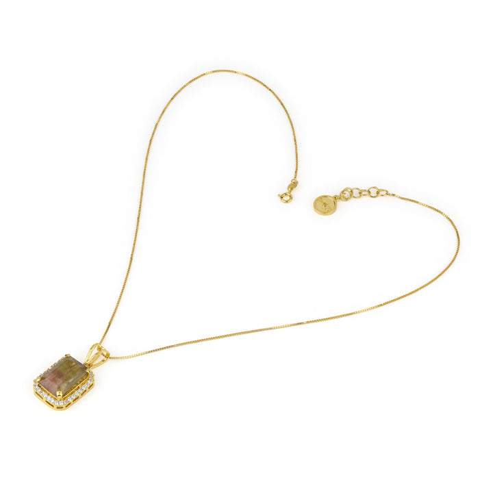 Natural bi-color watermelon tourmaline pendant necklace by Niz & Aly featuring a vibrant, polished gemstone on a silver chain.