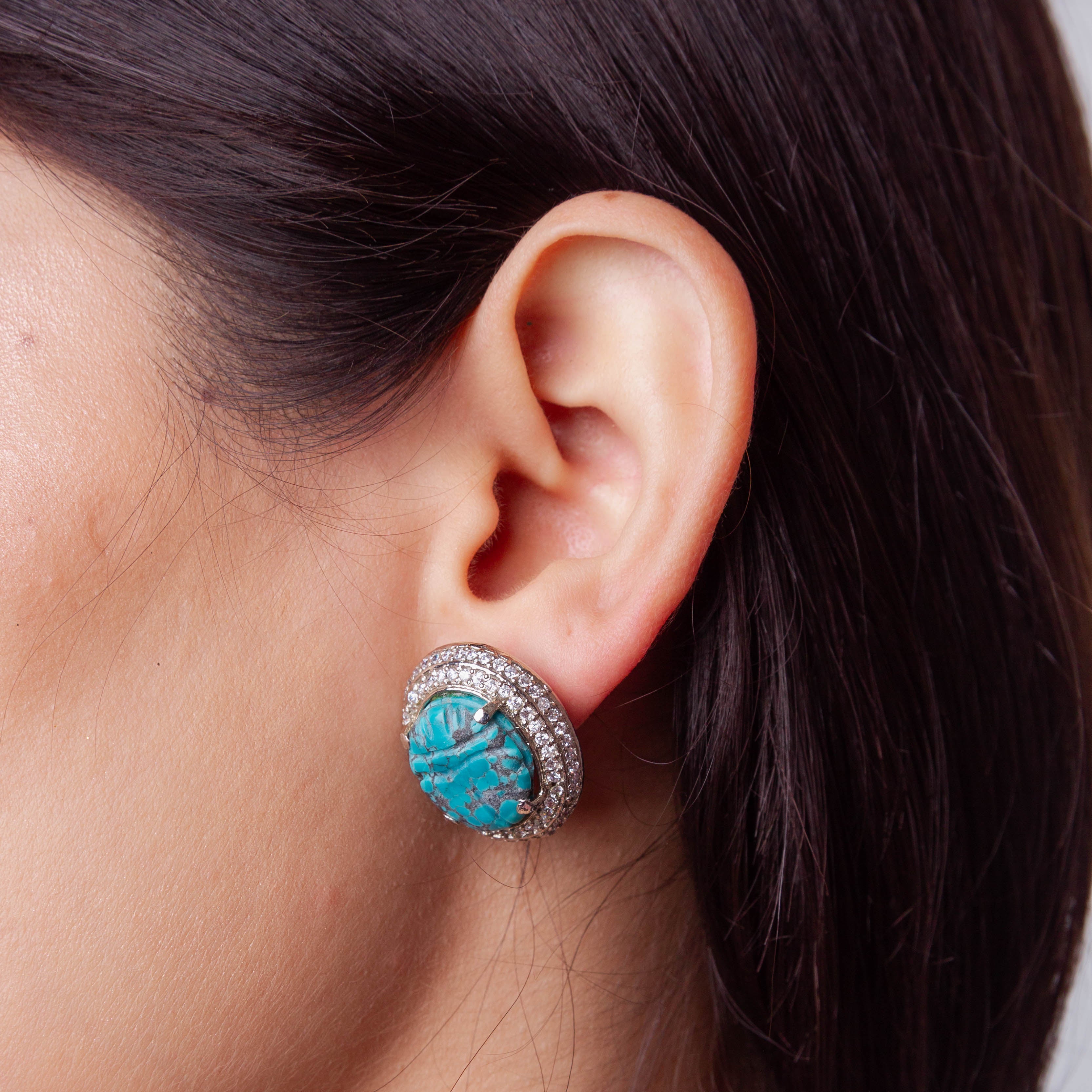 Carved Turquoise Pendant Set in Cubic Zirconia Setting