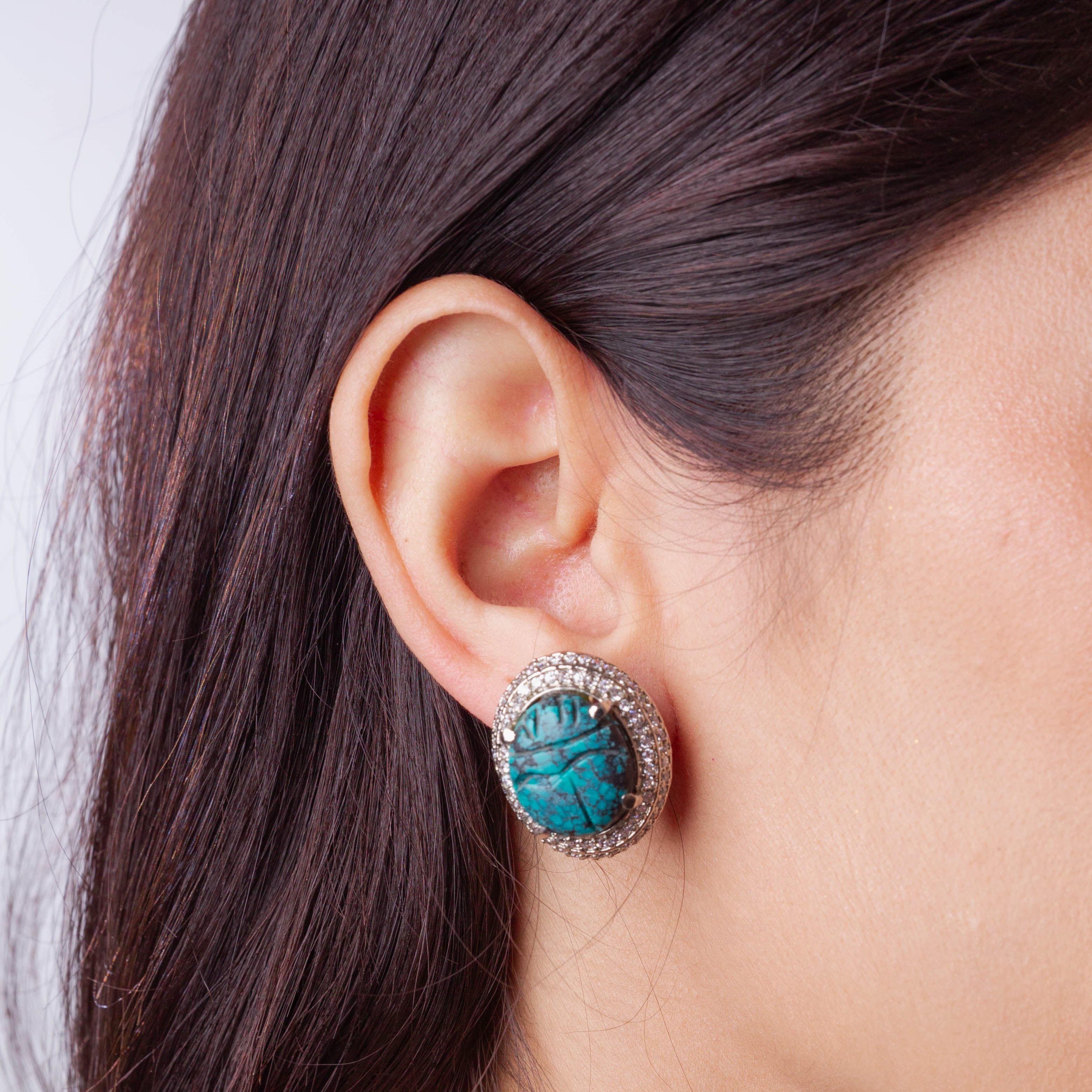 Carved Turquoise Pendant Set in Cubic Zirconia Setting