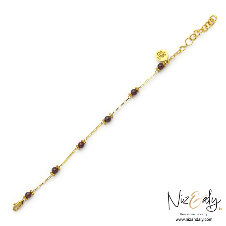 Dainty garnet bracelet with pyrope garnet beads and gold detailing