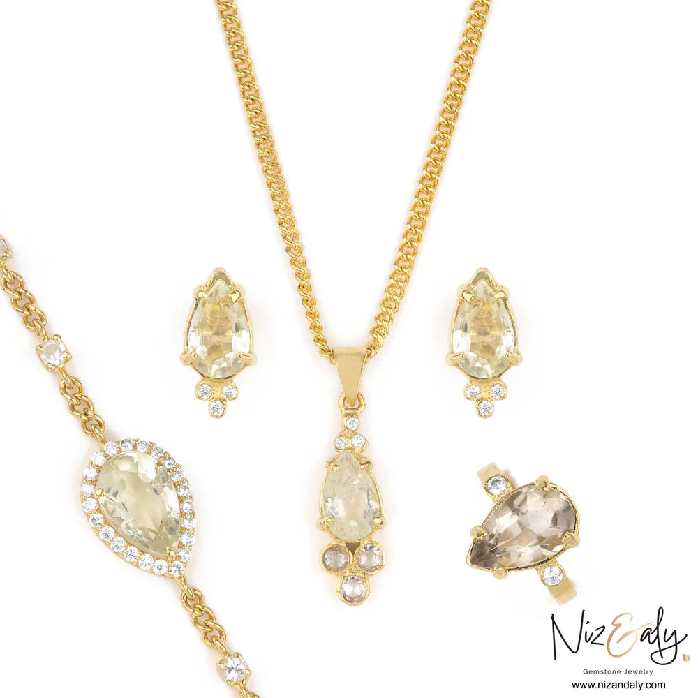 Clear quartz jewelry set in gold-plated 925 sterling silver with pendant, bracelet, stud earrings and adjustable ring