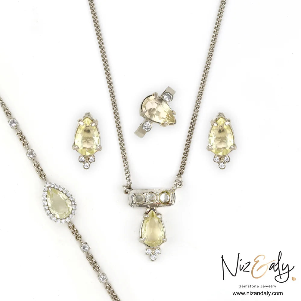 Clear quartz pendant set in 925 sterling silver with necklace, bracelet, stud earrings and adjustable ring