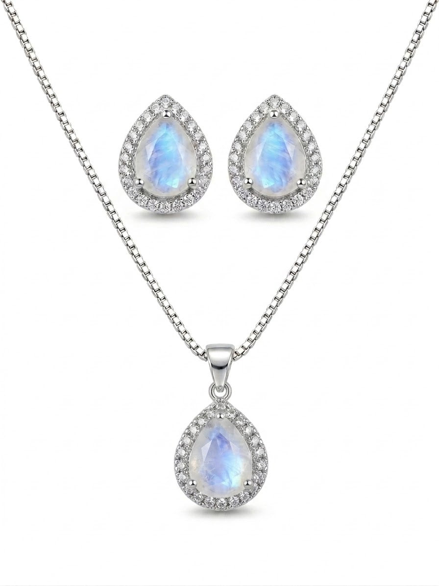 Blue Flash Moonstone pendant set by Niz & Aly, featuring a moonstone necklace and matching earrings on a jewelry display.