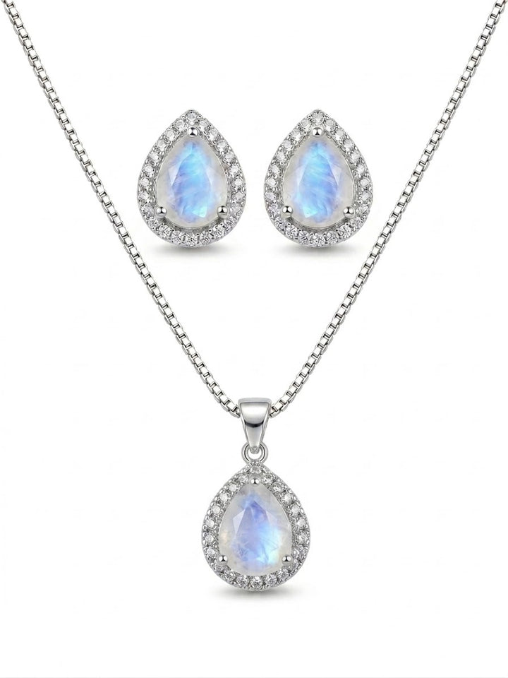 Blue Flash Moonstone pendant set by Niz & Aly, featuring a moonstone necklace and matching earrings on a jewelry display.