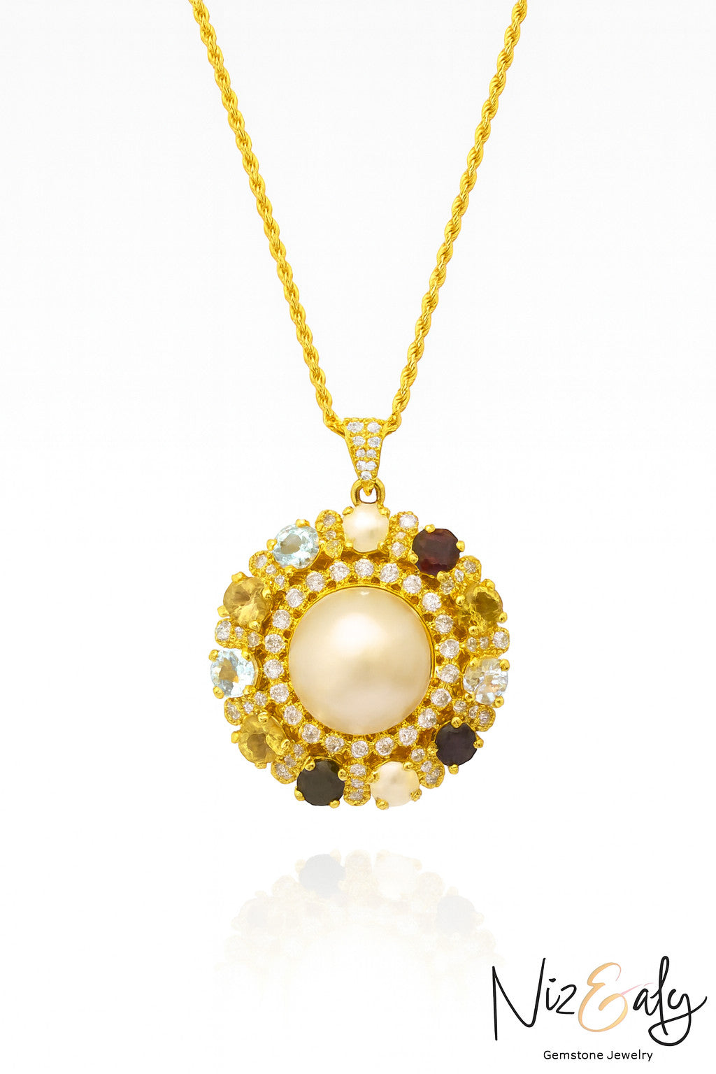 Niz & Aly gold-tone pendant necklace featuring a central pearl, multi-colored gemstones, and a white stone halo.