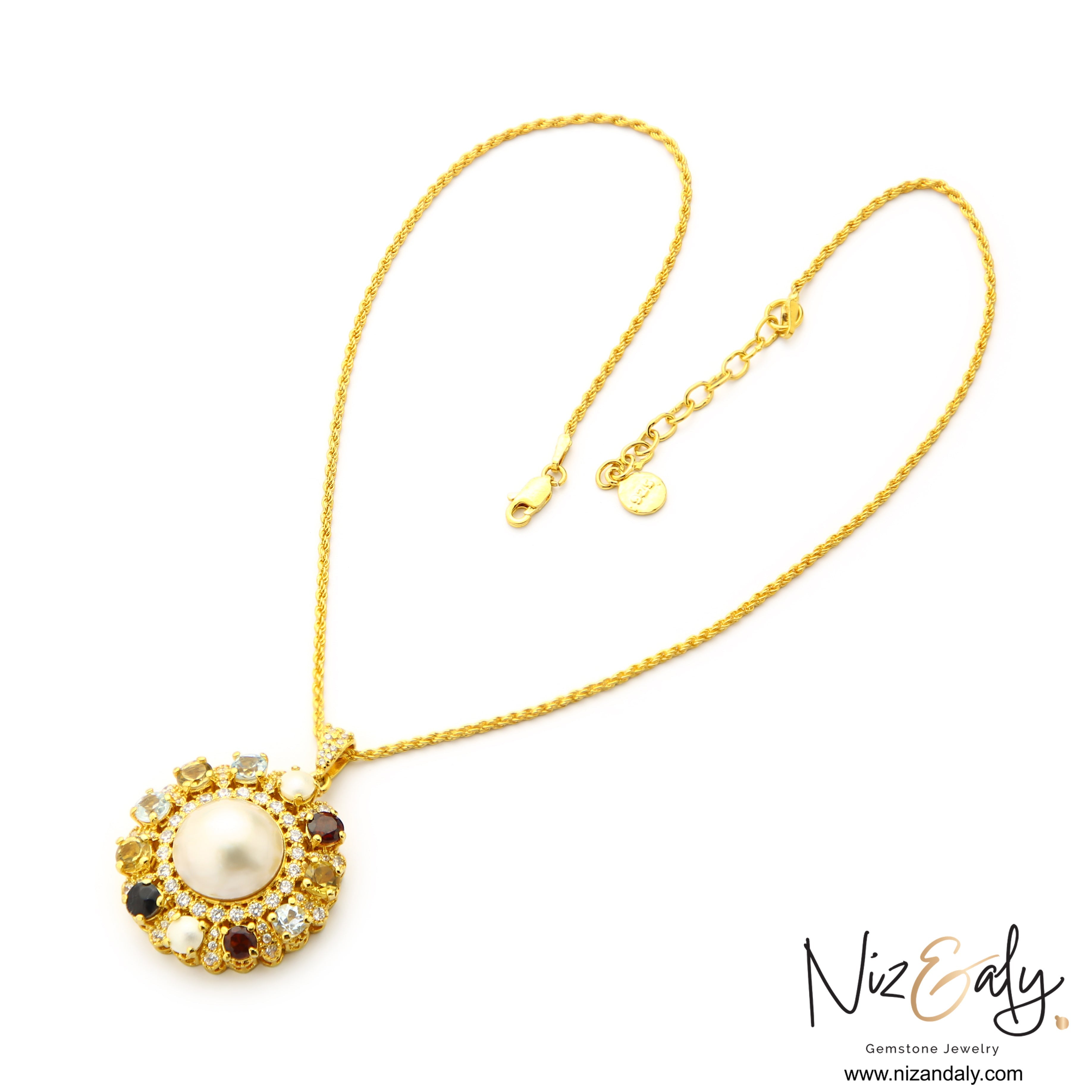 Niz & Aly gold-tone pendant necklace featuring a central pearl surrounded by multi-colored gemstones and white stones.