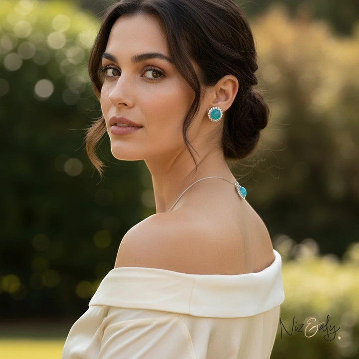 Niz & Aly amazonite pendant and earring set featuring polished blue-green natural stones on a woman in a white top