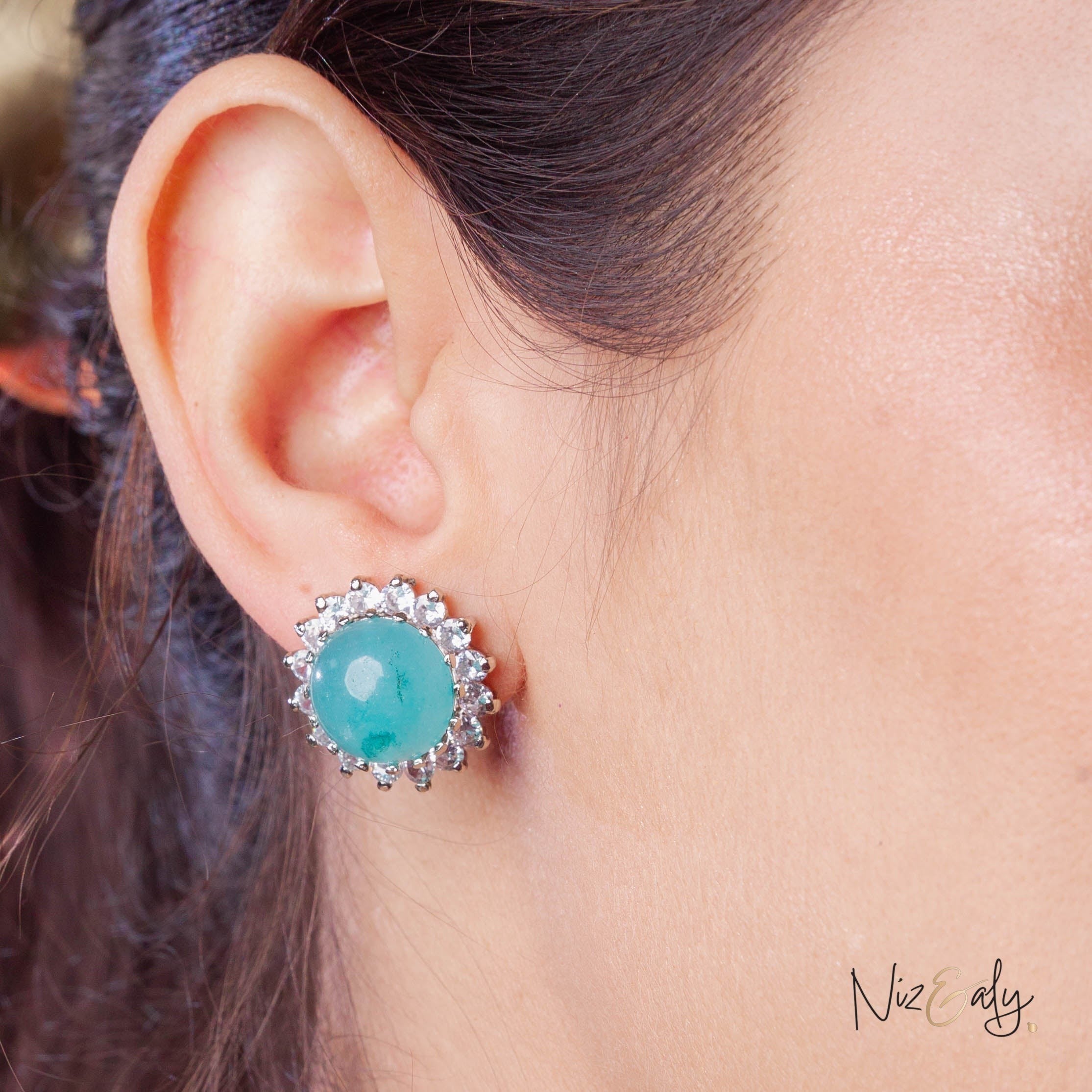 Niz & Aly amazonite stud earring featuring a round blue-green gemstone surrounded by sparkling white crystals