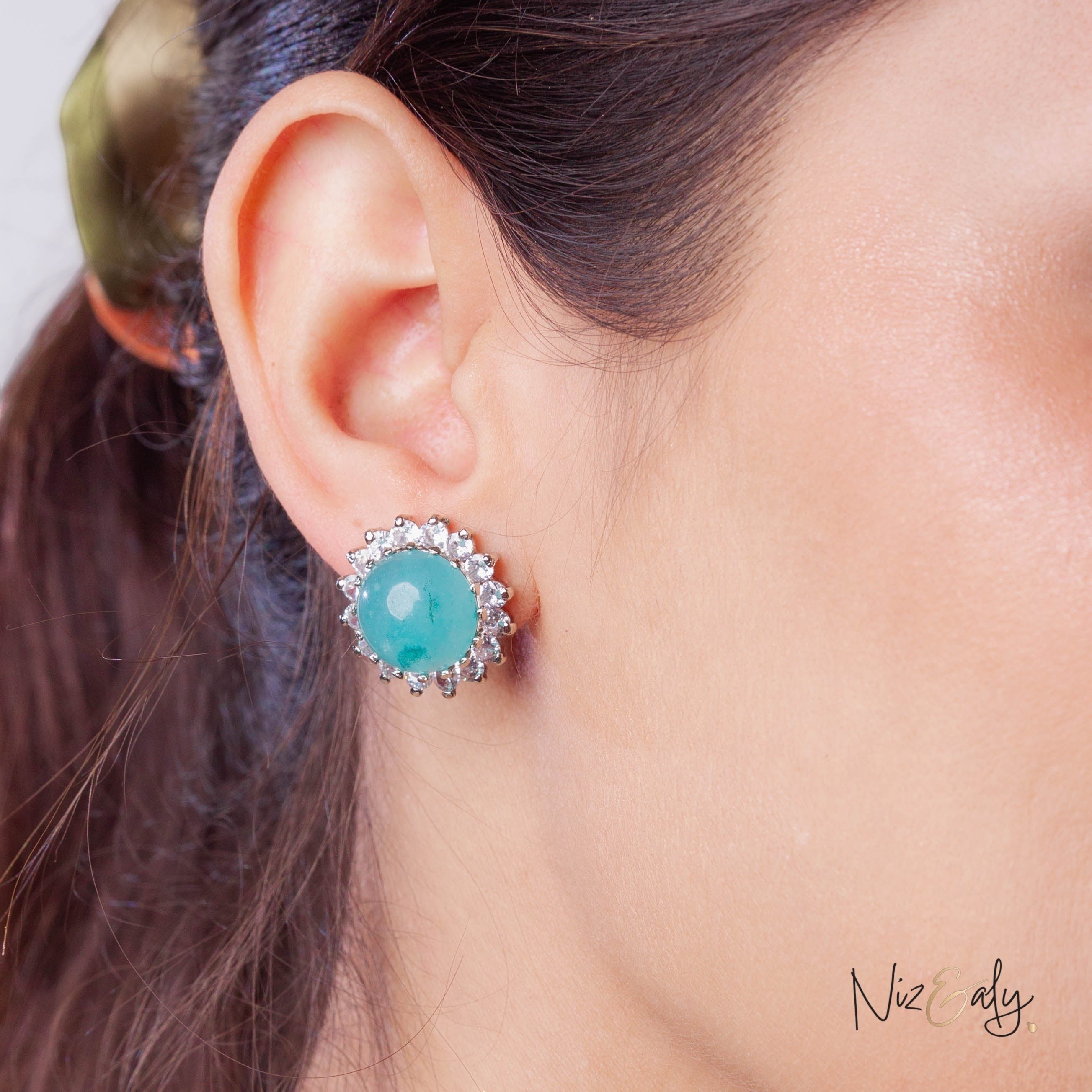 Niz & Aly amazonite stud earring featuring a polished blue-green gemstone surrounded by sparkling crystals on an ear