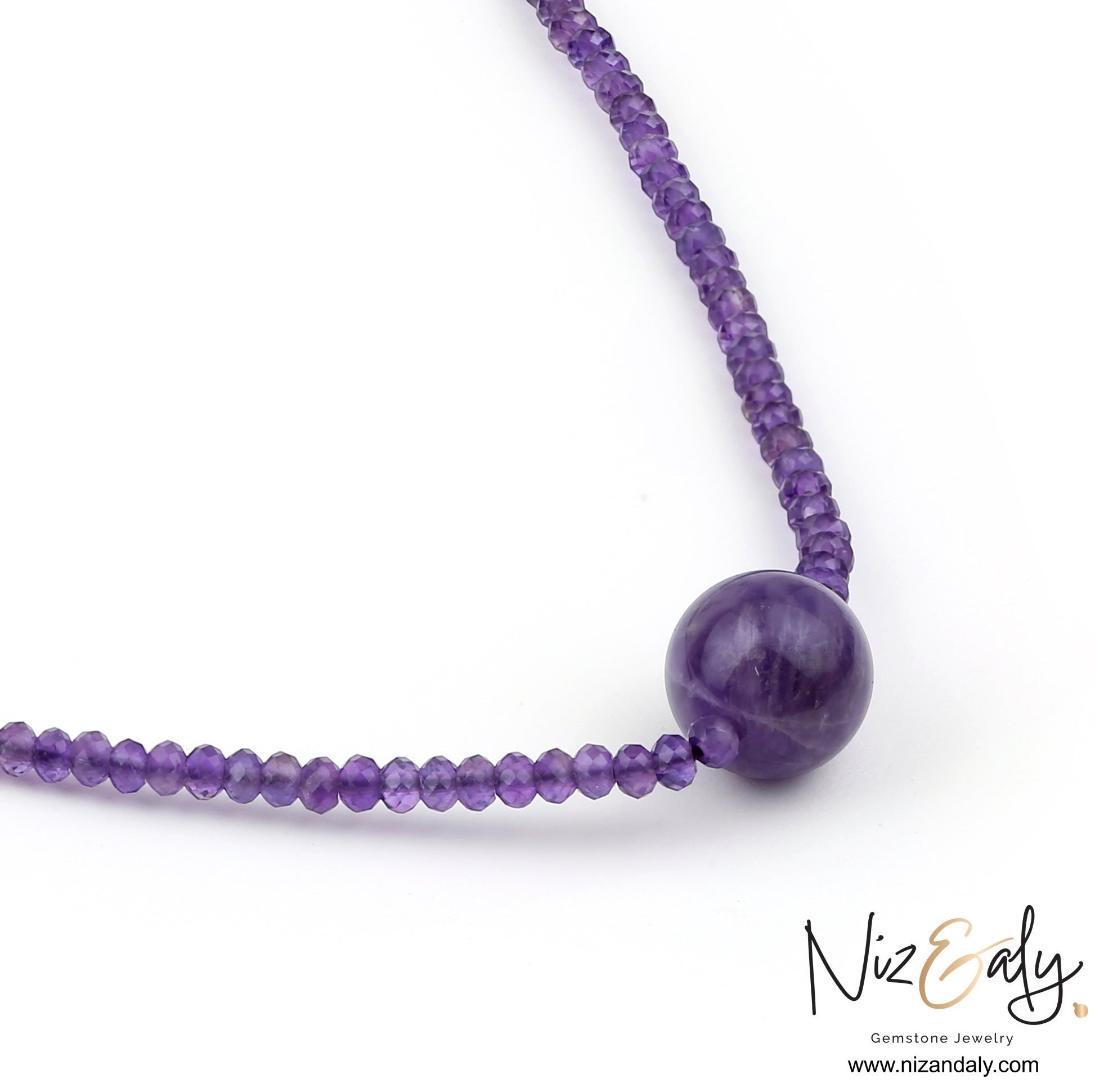 Niz & Aly Celestial Dew necklace featuring a strand of faceted purple amethyst beads with a central smooth sphere.