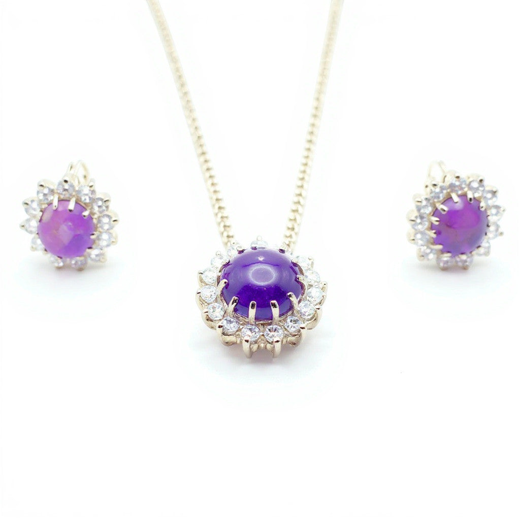 Niz & Aly oval cabochon amethyst pendant and earring set with sparkling white stone halo accents in silver setting.