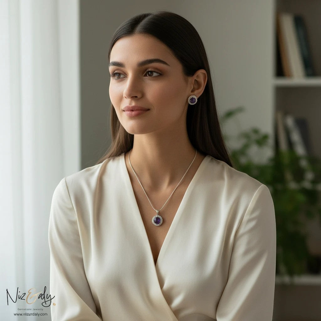 Niz & Aly amethyst constellation pendant and earring set worn by a woman in a white blouse