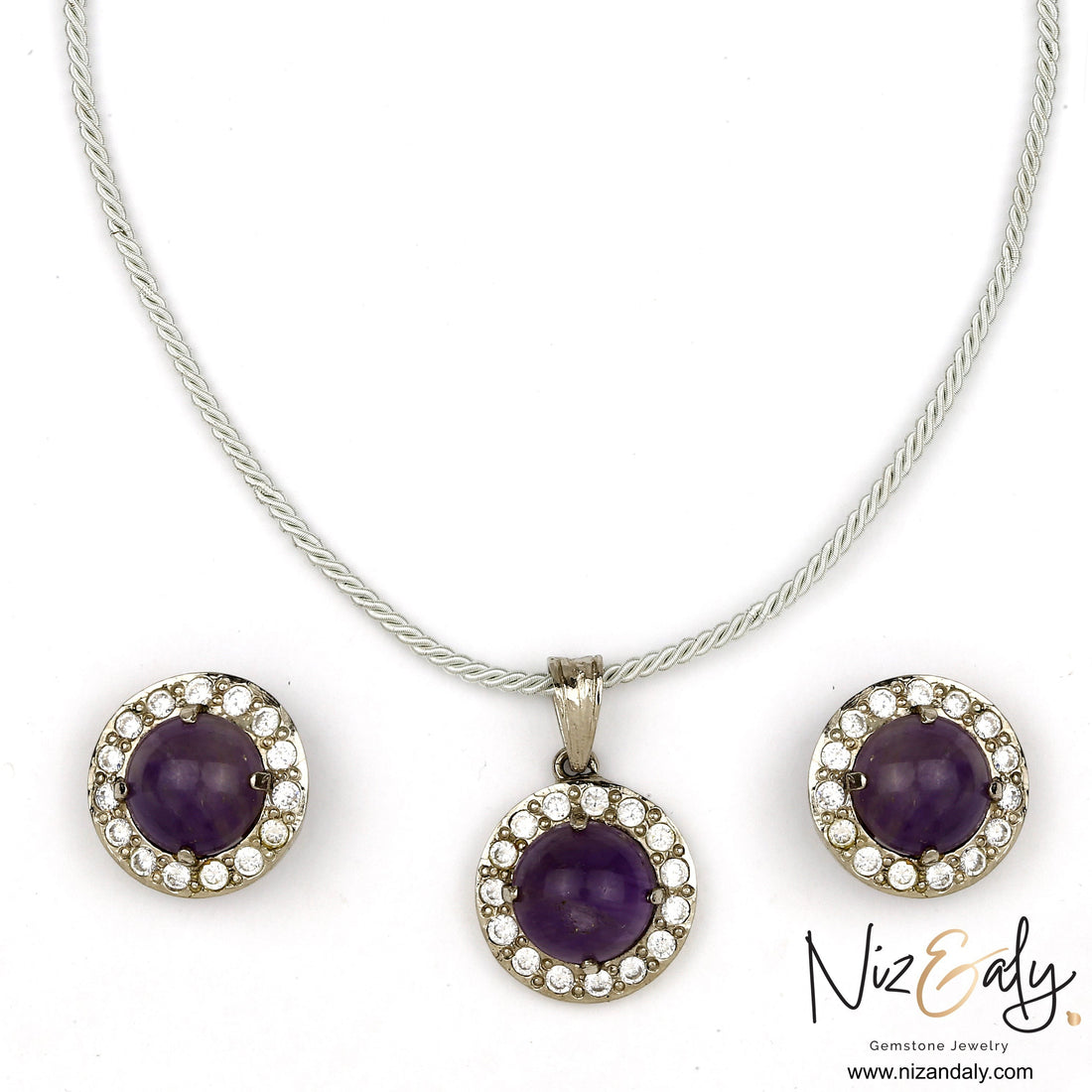 Niz & Aly amethyst constellation pendant and earring set with violet cabochon stones and sparkling crystal halos.
