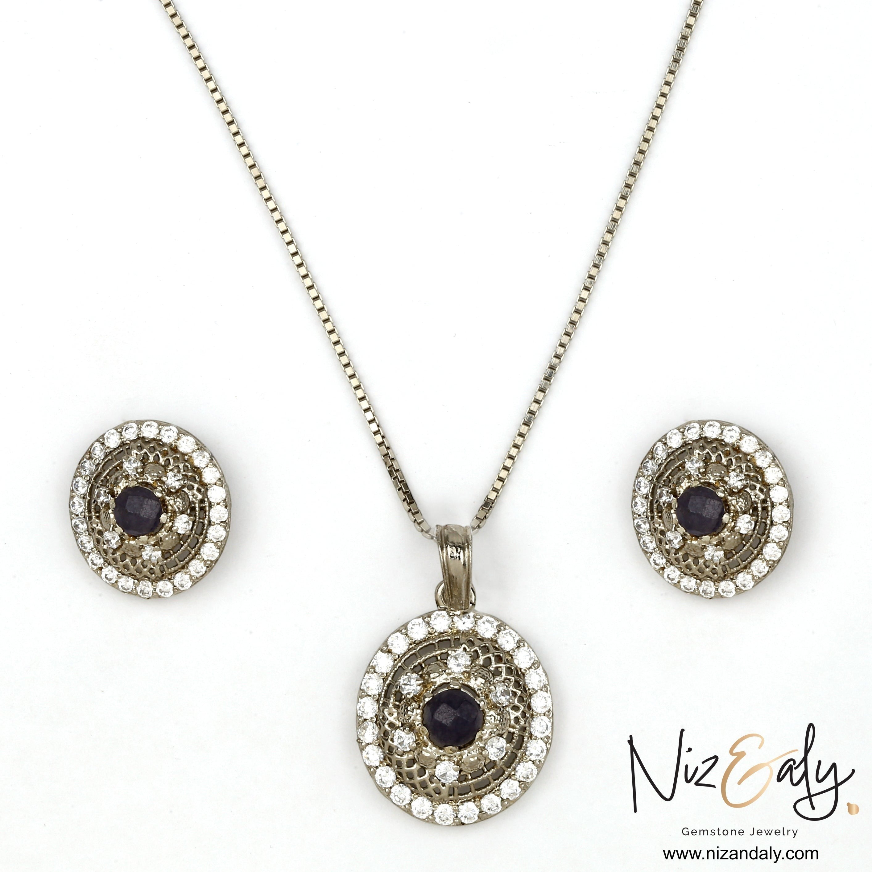 Niz & Aly round natural amethyst pendant and earring set with white cubic zirconia accents in a silver-tone finish.