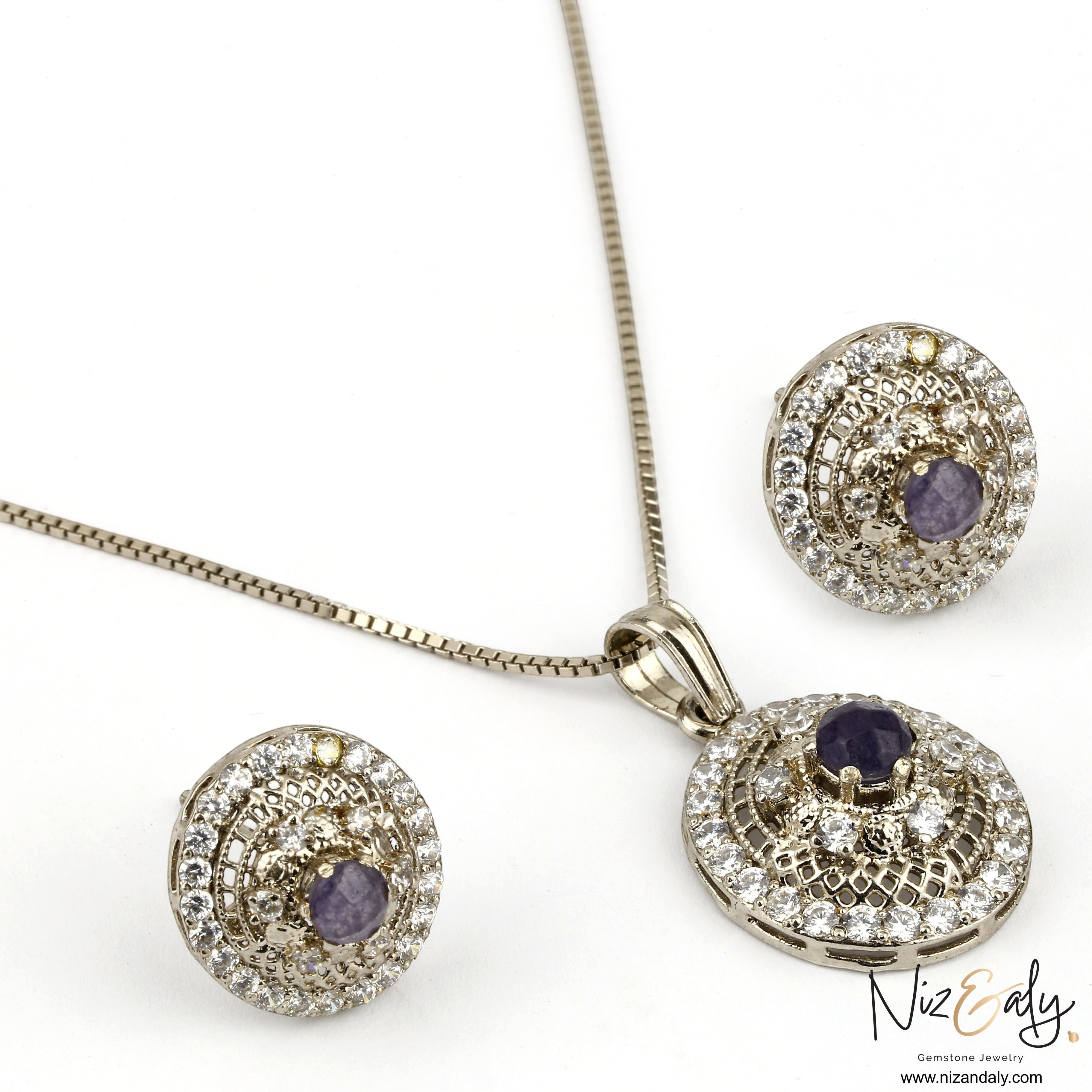 Niz & Aly round natural amethyst pendant and earring set with white cubic zirconia accents in a silver-tone finish.