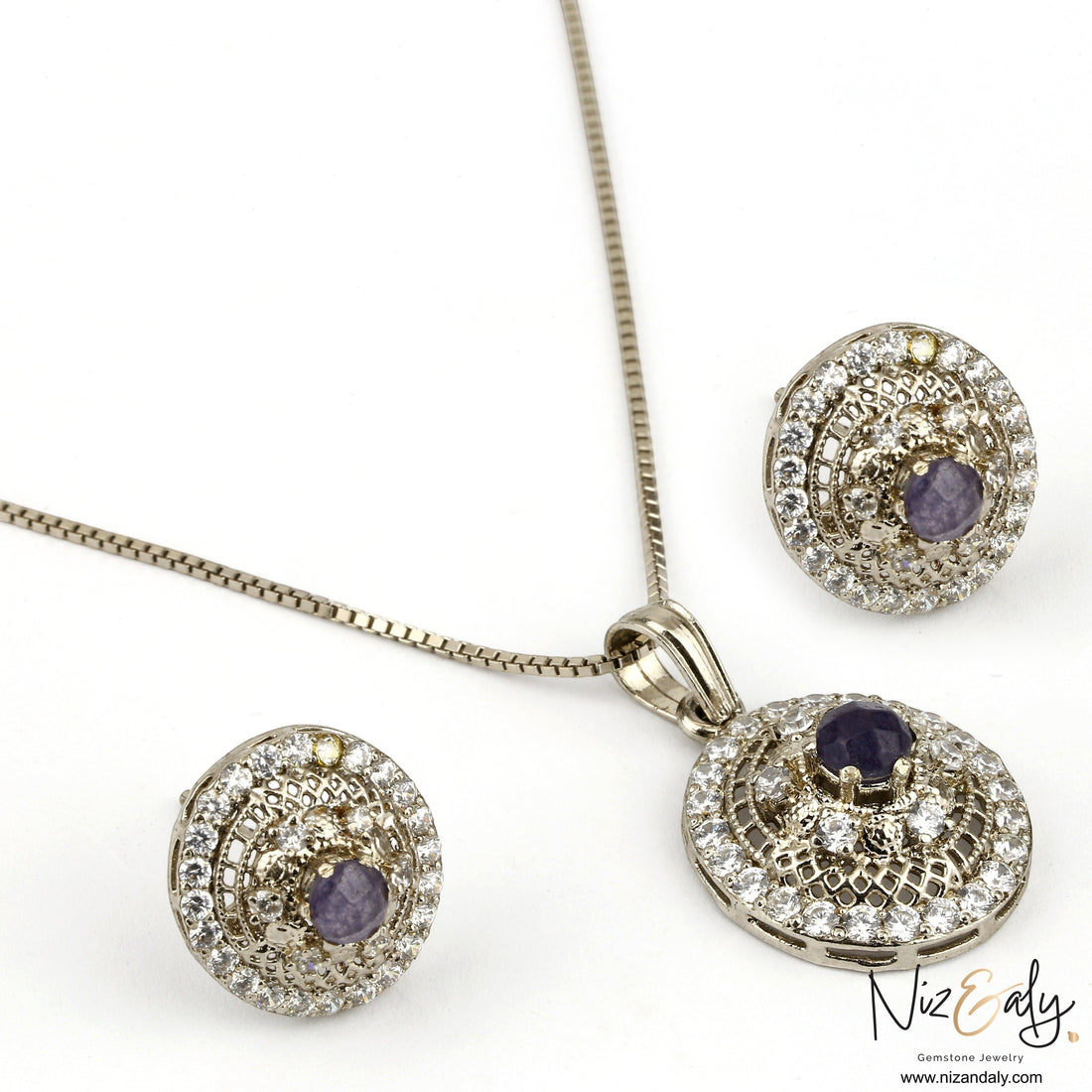 Niz & Aly round natural amethyst pendant and earring set with white cubic zirconia accents in a silver-tone finish.