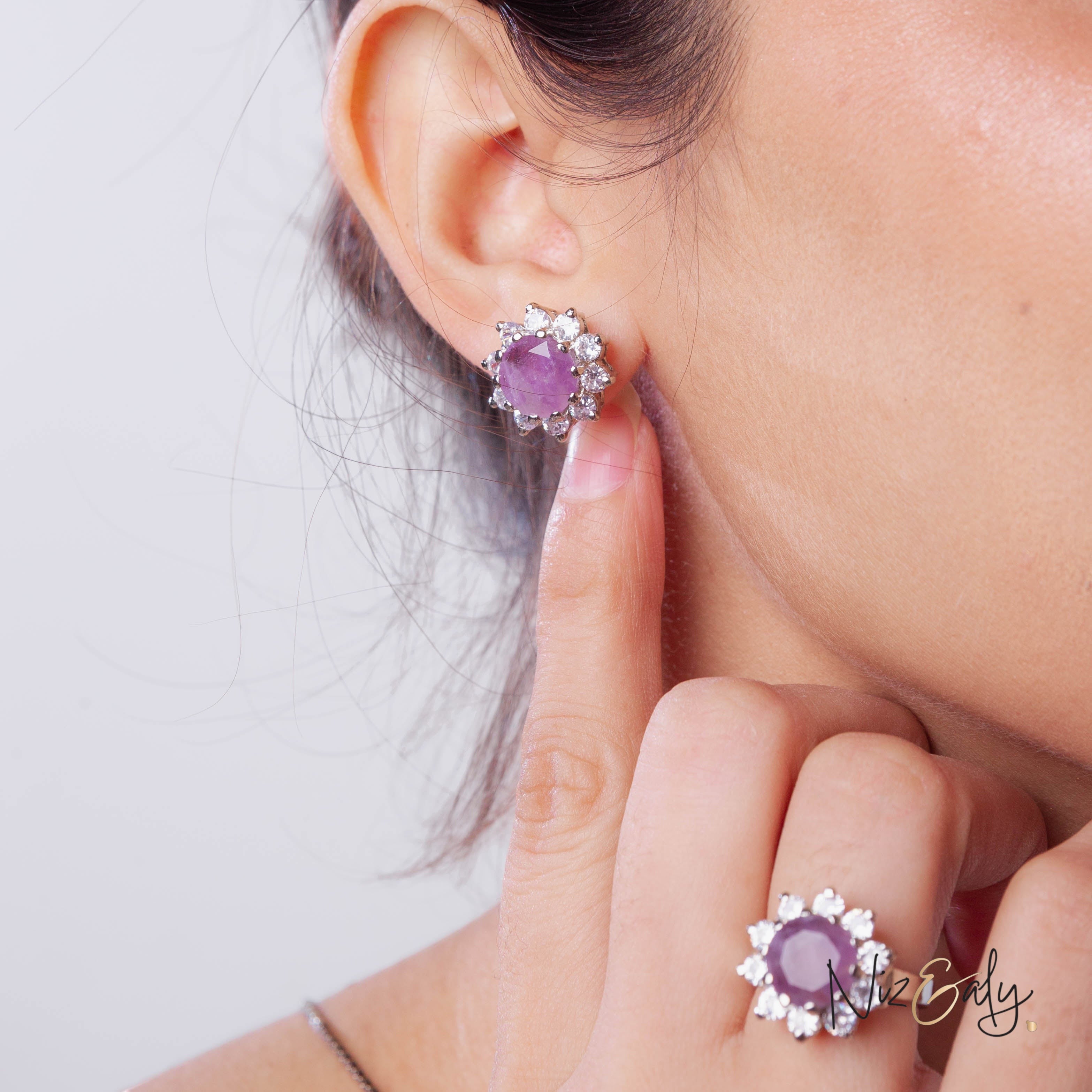 Niz & Aly amethyst and diamond floral stud earrings and matching ring worn by a woman