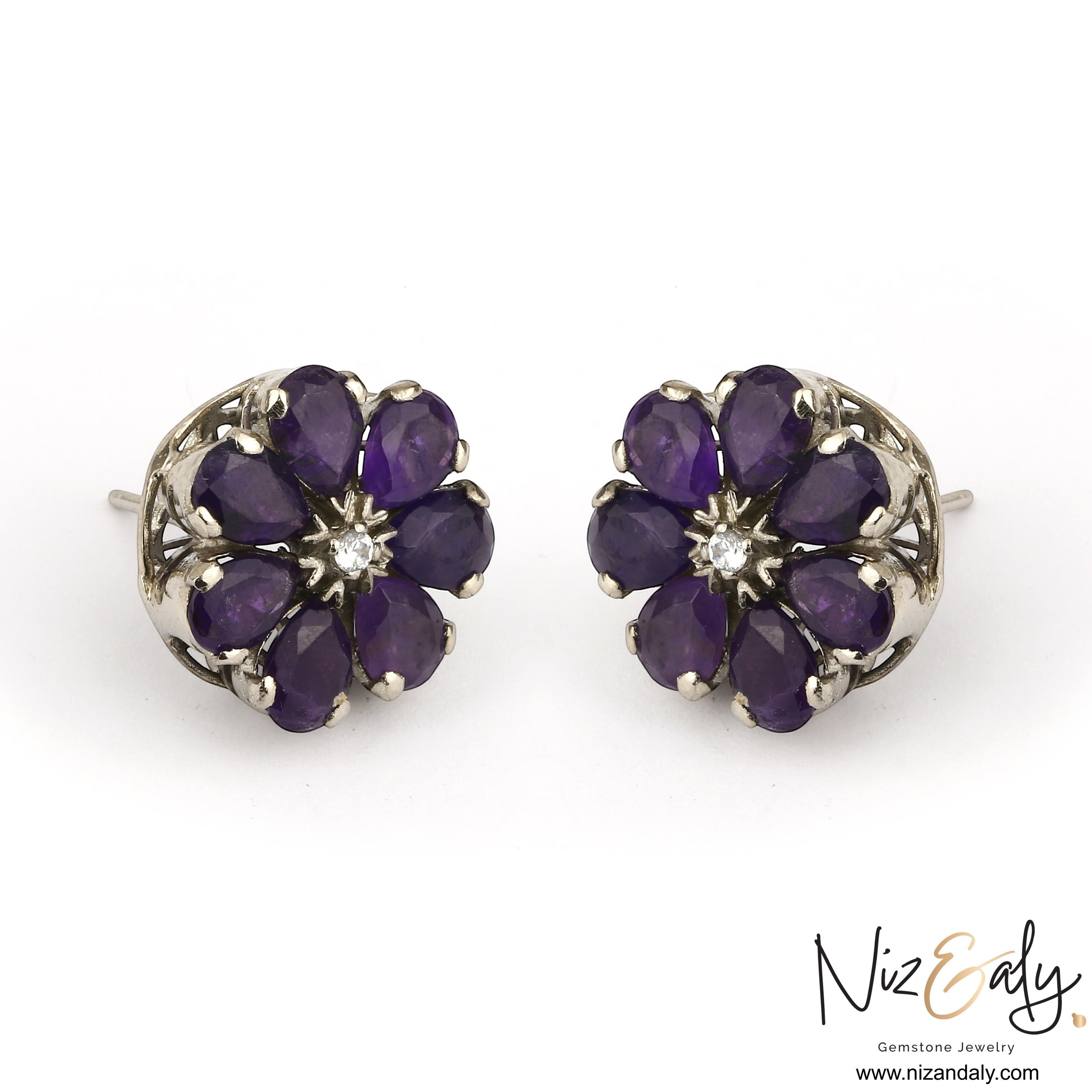 Niz & Aly amethyst flower ear studs with purple teardrop gemstones and a central diamond in a silver setting.