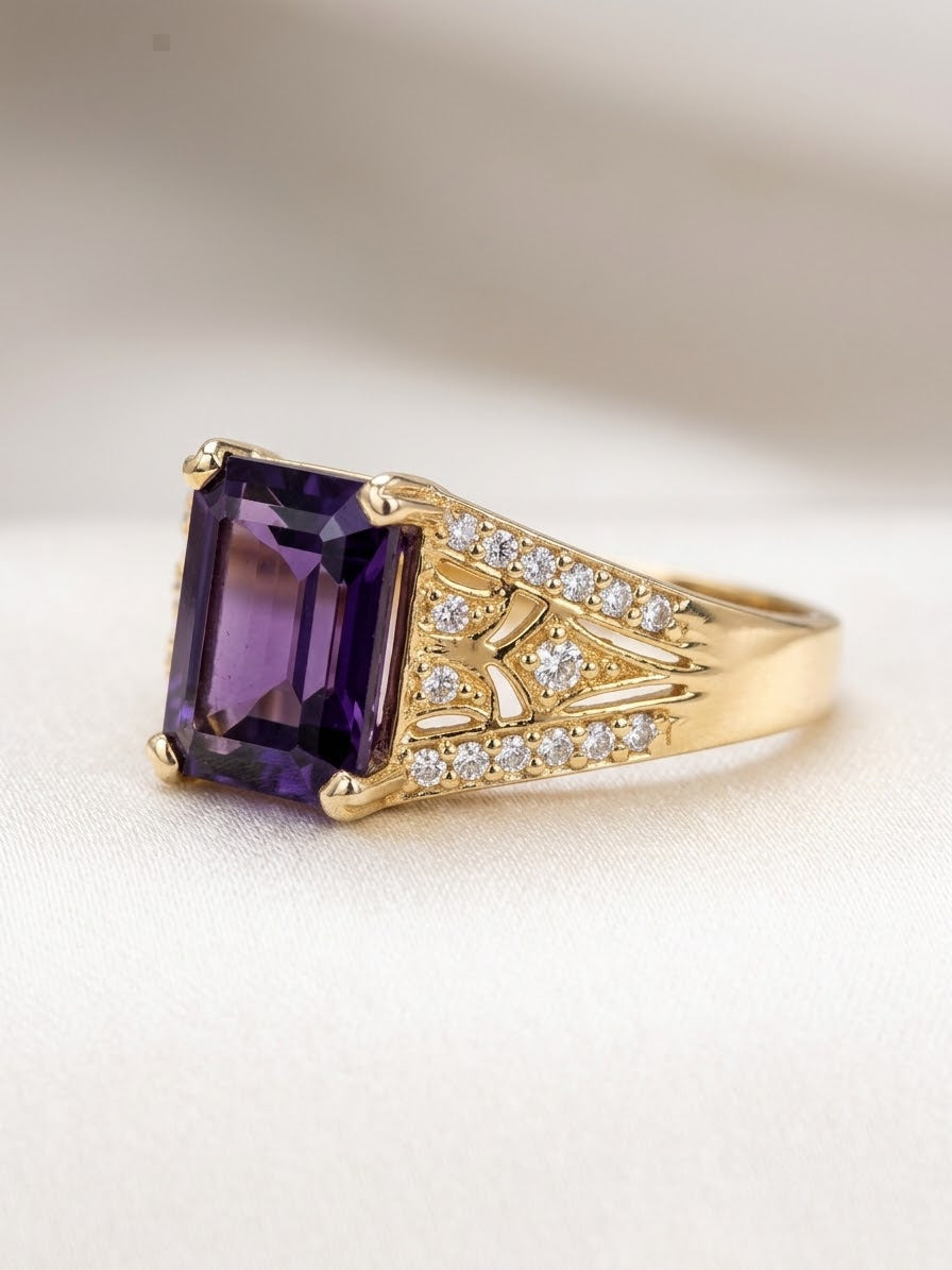 Niz & Aly gold-plated sterling silver ring featuring a square-cut deep violet amethyst and shimmering accent stones.