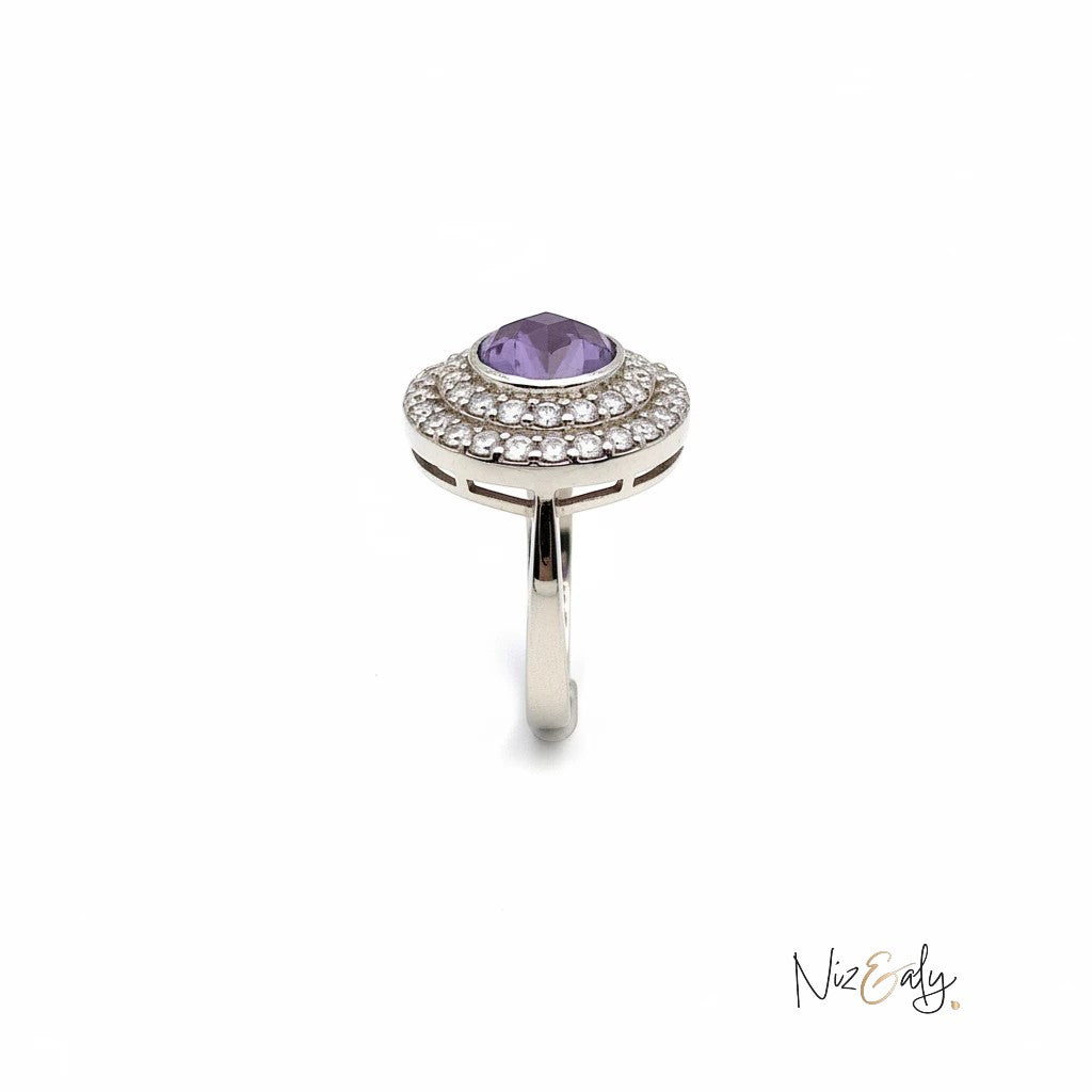 Niz & Aly Amethyst in Hemisphere Ring featuring a violet dome stone surrounded by a halo of sparkling white diamonds.