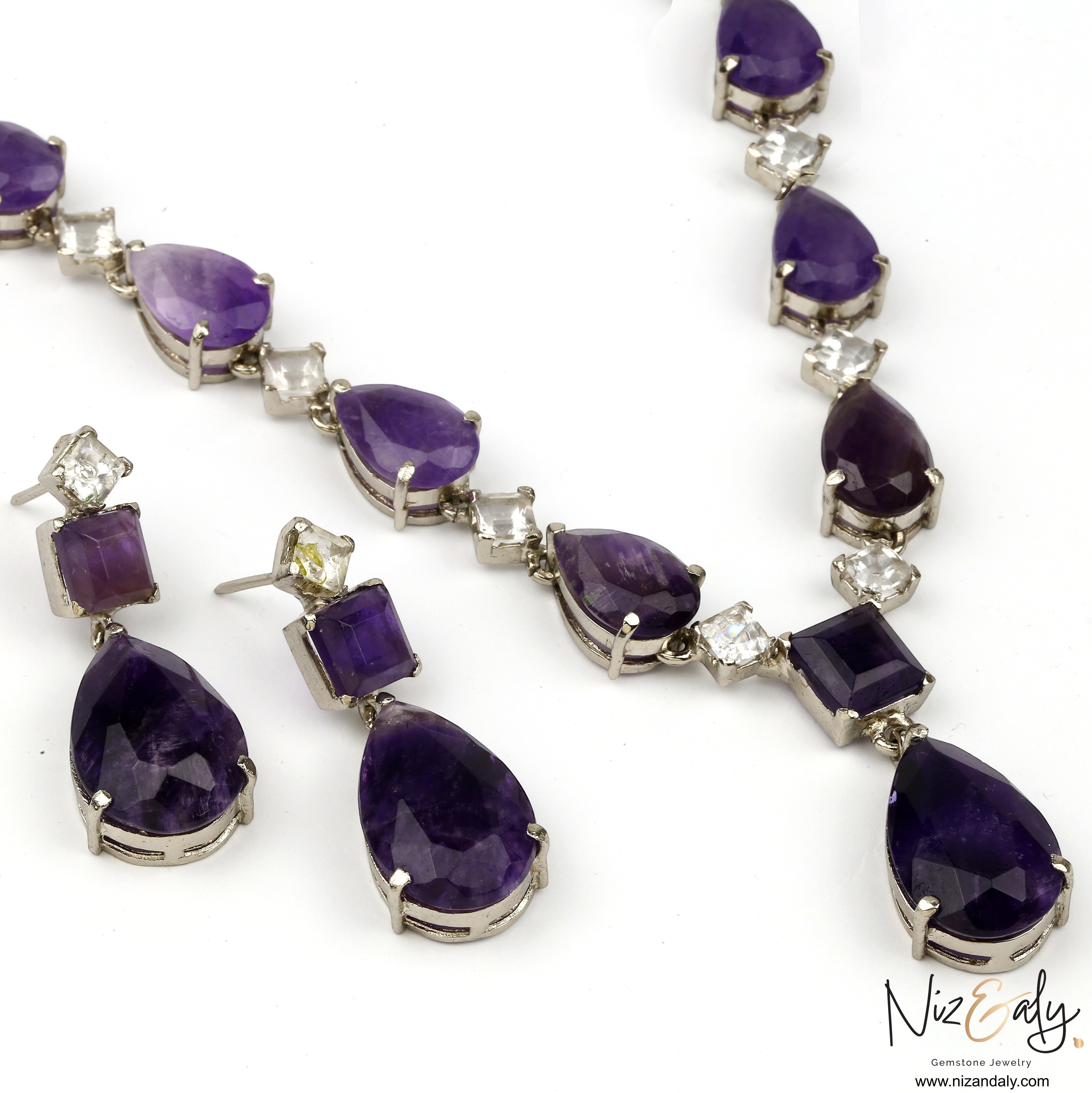 Niz & Aly amethyst and Herkimer diamond necklace and earring set featuring droplet-cut purple gemstones in silver.