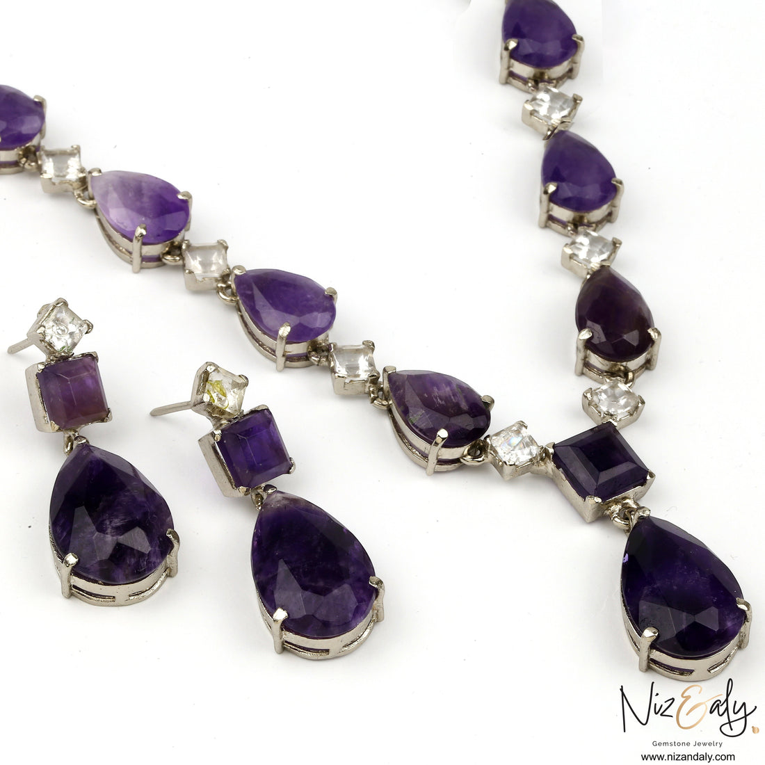 Niz & Aly amethyst and Herkimer diamond necklace and earring set featuring droplet-cut purple gemstones in silver.