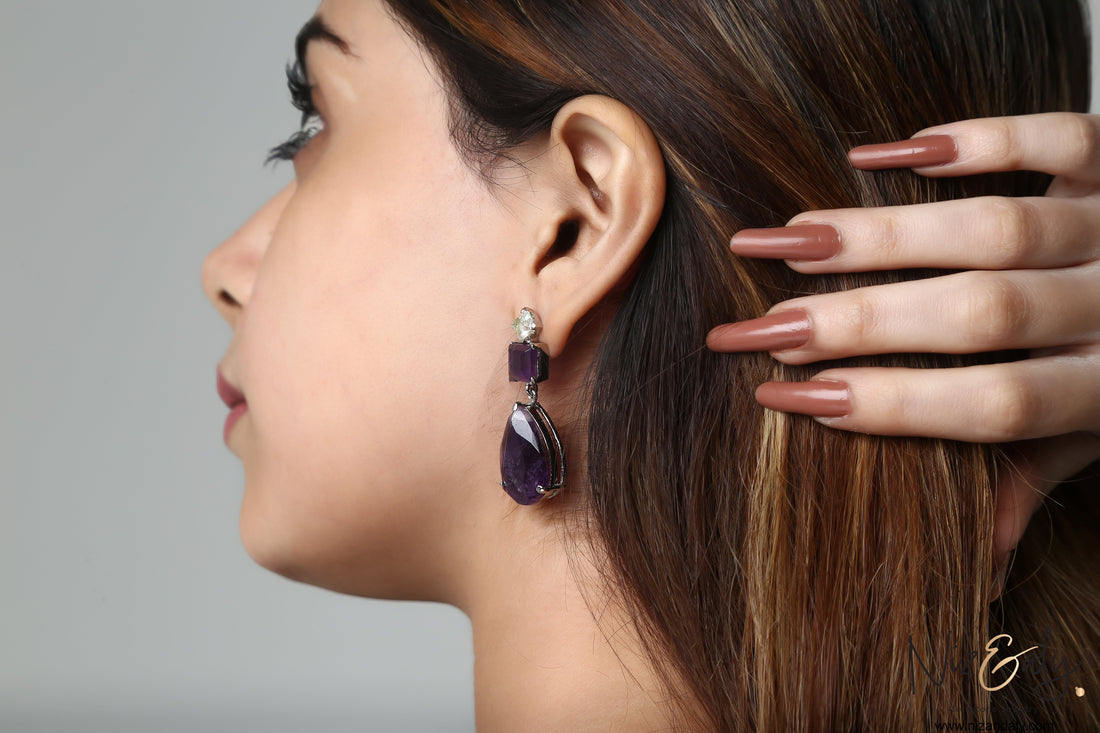 Niz & Aly droplet amethyst and Herkimer diamond earring worn by a woman with long brown hair