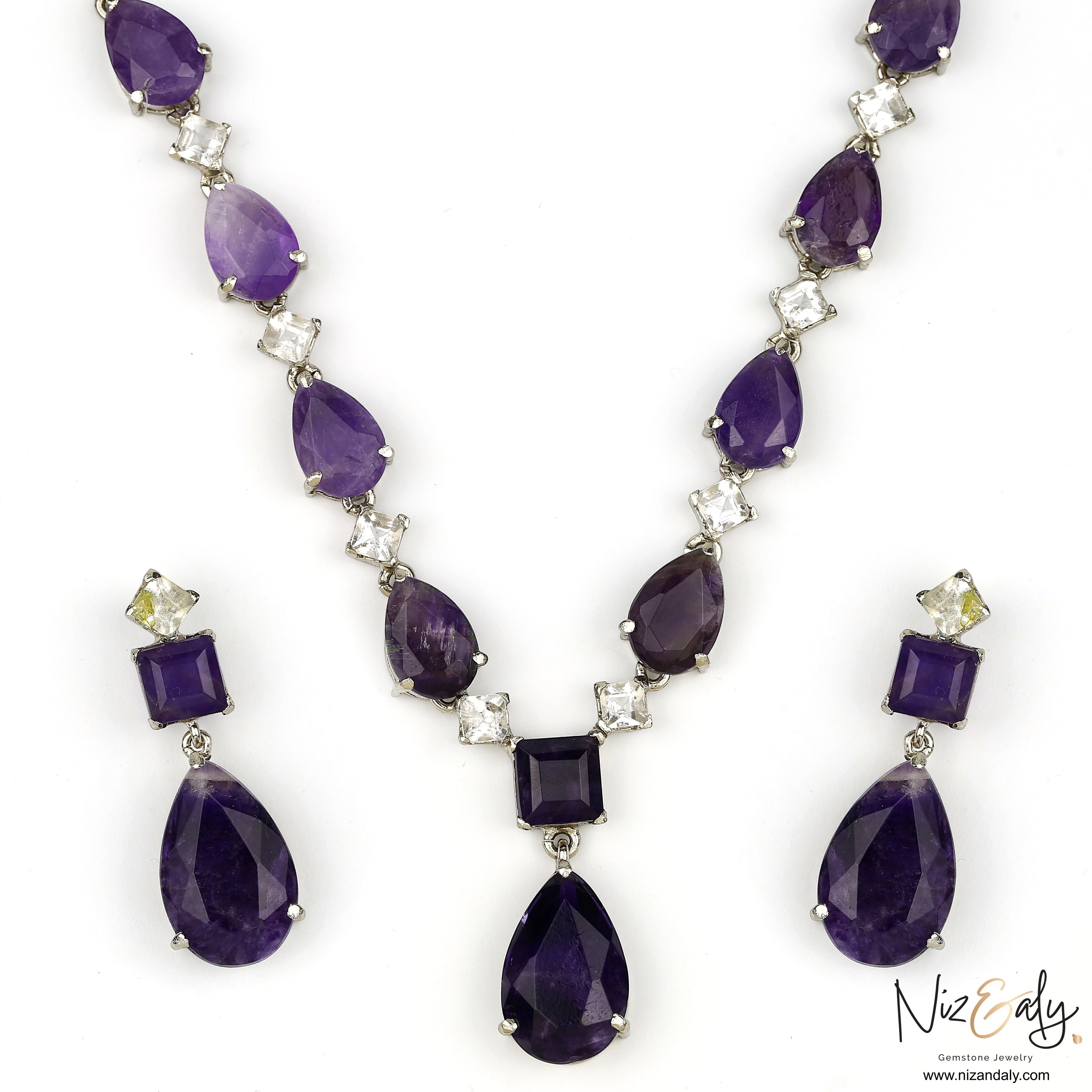 Niz & Aly necklace and earring set featuring droplet-cut purple amethyst and clear Herkimer diamond gemstones.