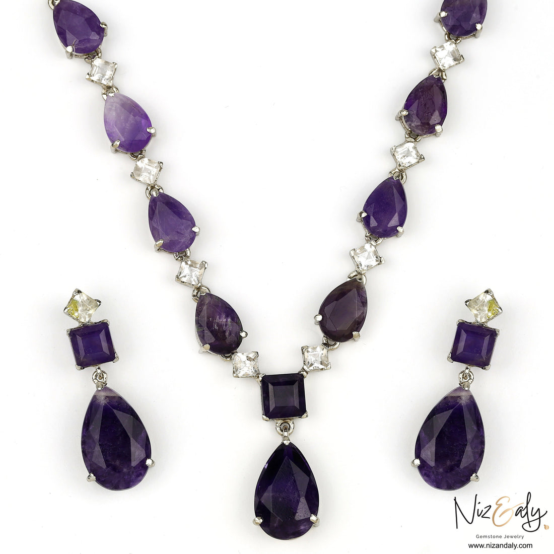 Niz & Aly necklace and earring set featuring droplet-cut purple amethyst and clear Herkimer diamond gemstones.