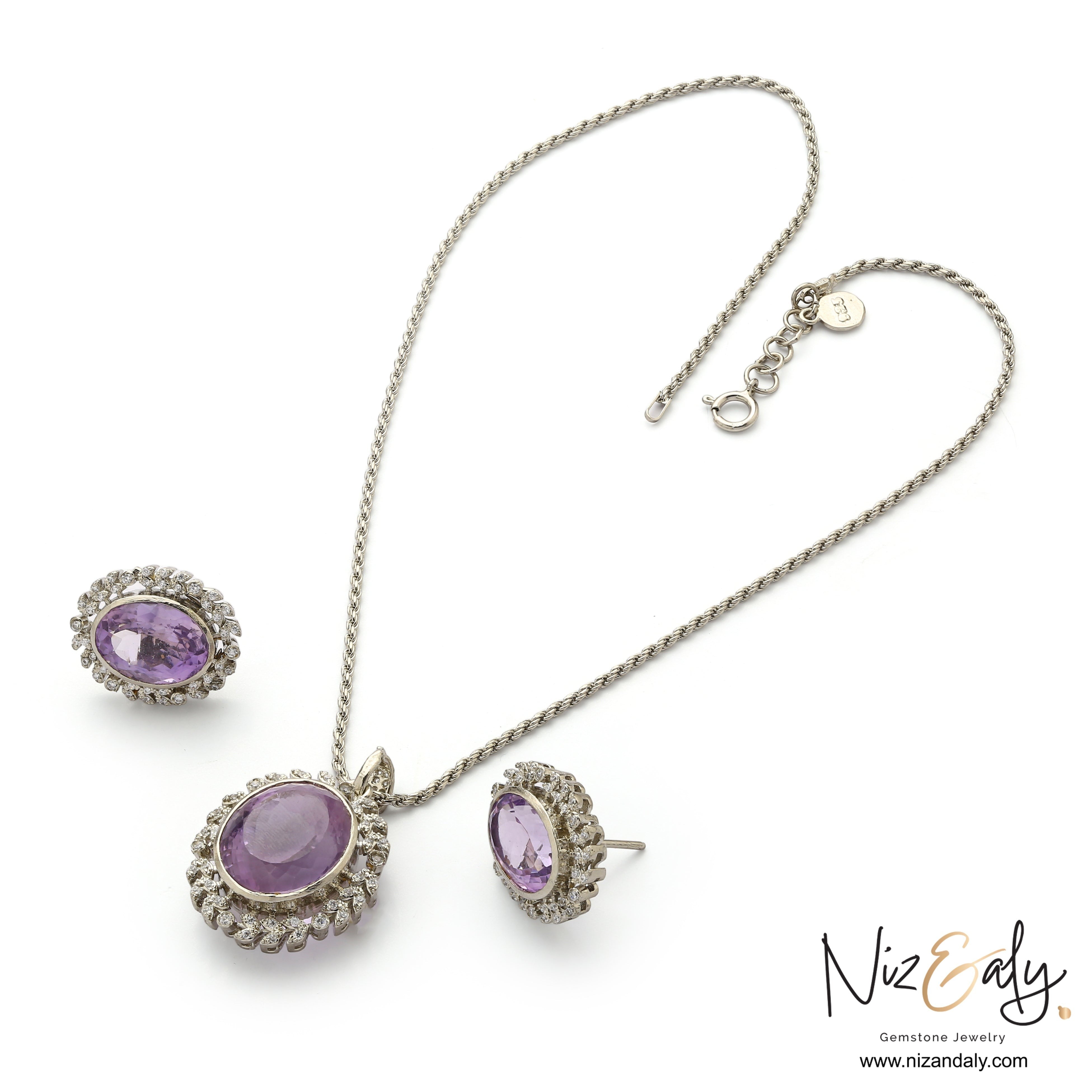 Niz & Aly Lavender Whisper amethyst pendant and earring set with oval-cut purple stones and white halo accents.