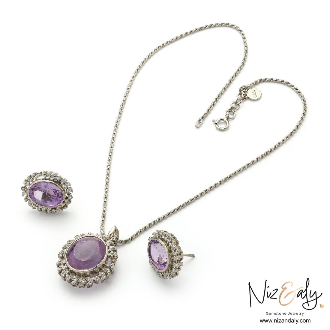 Niz & Aly Lavender Whisper amethyst pendant and earring set with oval-cut purple stones and white halo accents.