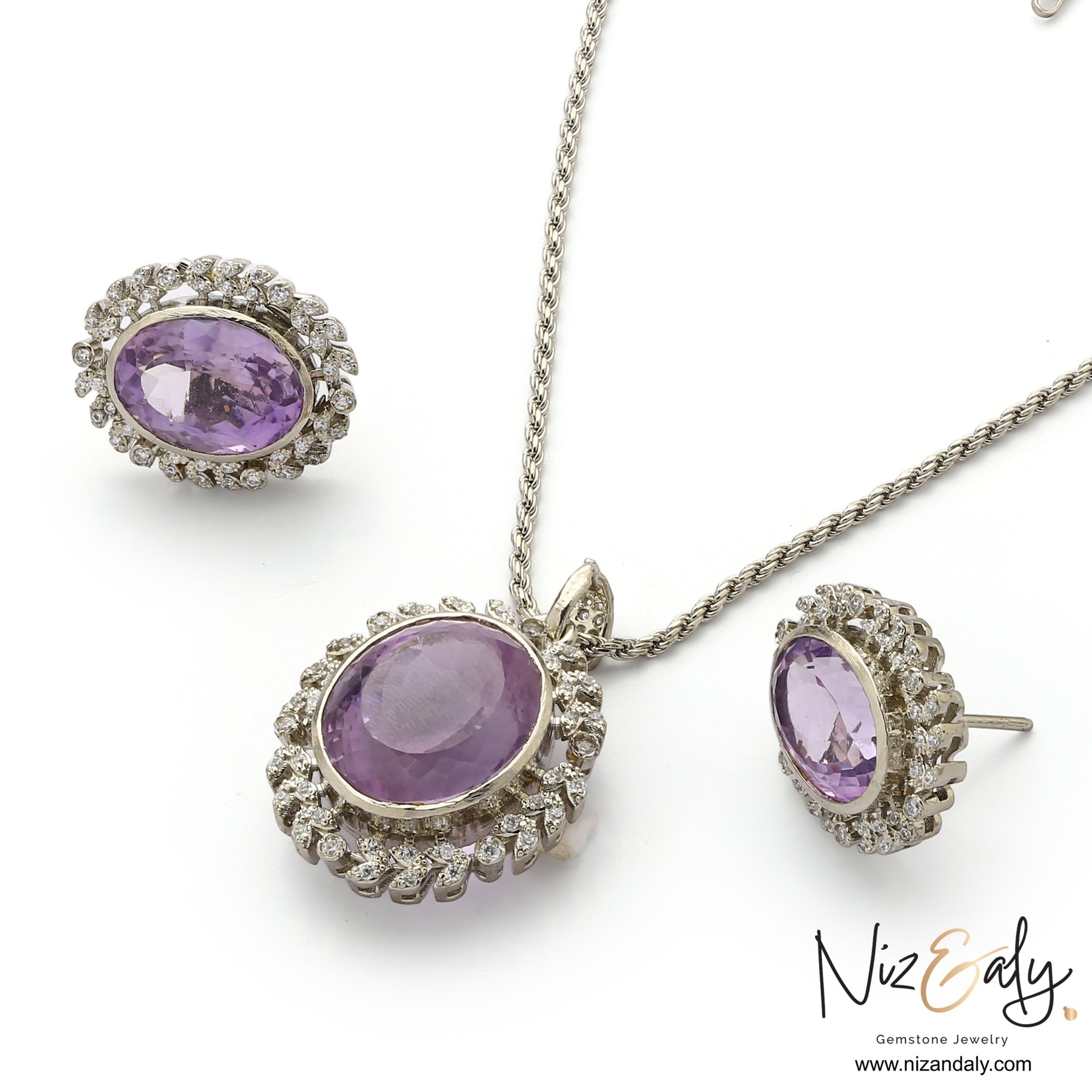 Niz & Aly Lavender Whisper amethyst pendant and earring set with oval-cut purple stones and white stone halo accents.