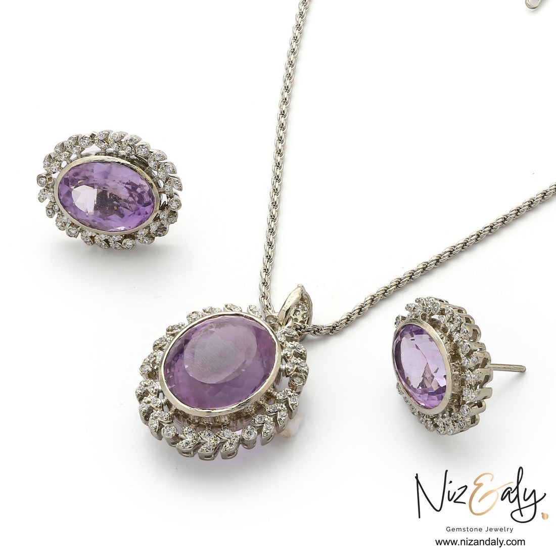 Niz & Aly Lavender Whisper amethyst pendant and earring set with oval-cut purple stones and white stone halo accents.