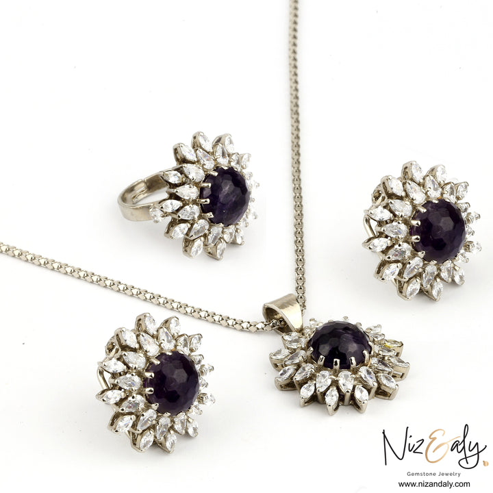 Niz & Aly amethyst pendant set with matching earrings and ring featuring deep purple gemstones and clear crystals.
