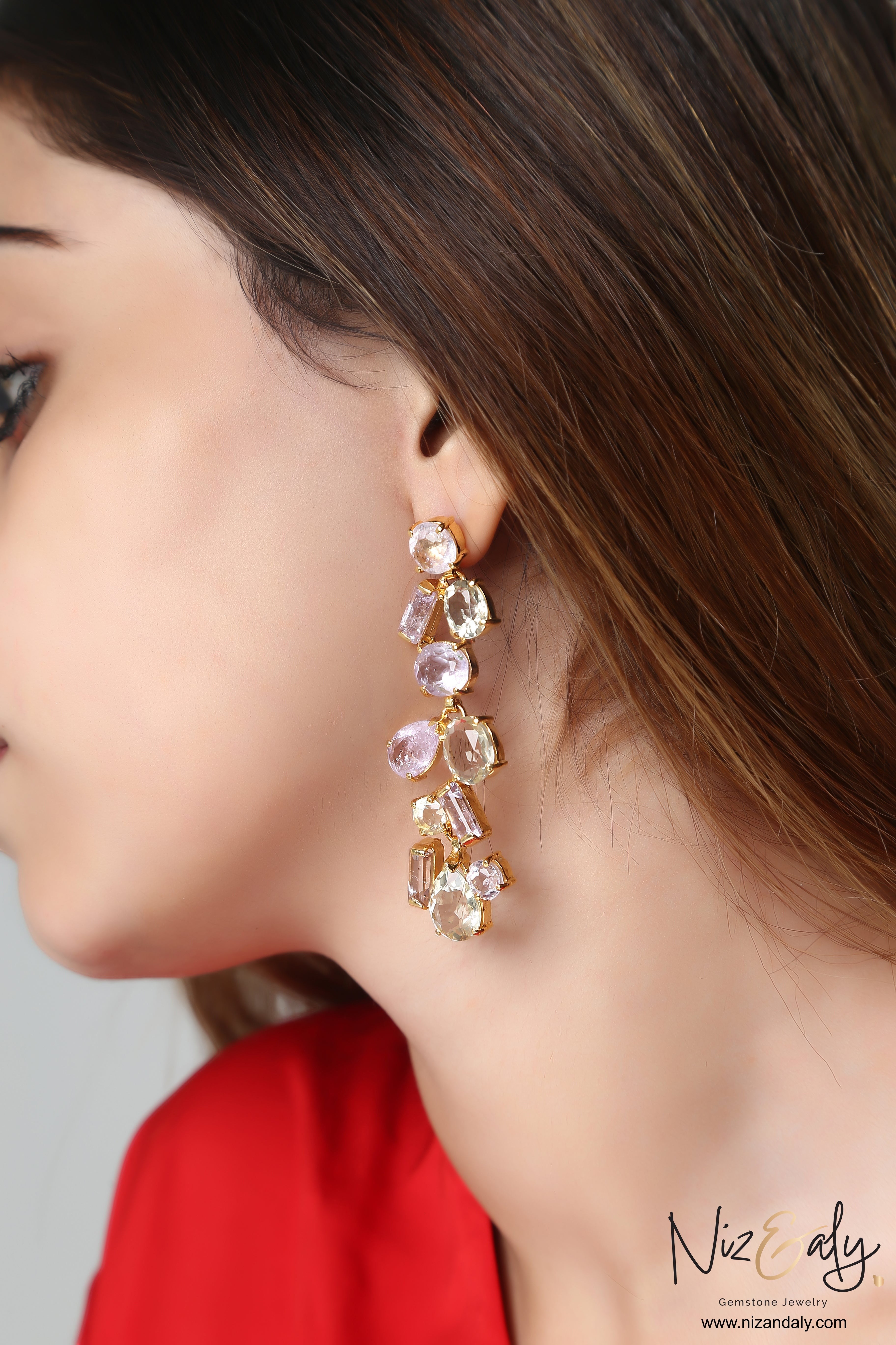 Niz & Aly natural ametrine and citrine dangle drop earrings with purple and yellow gemstones on a model