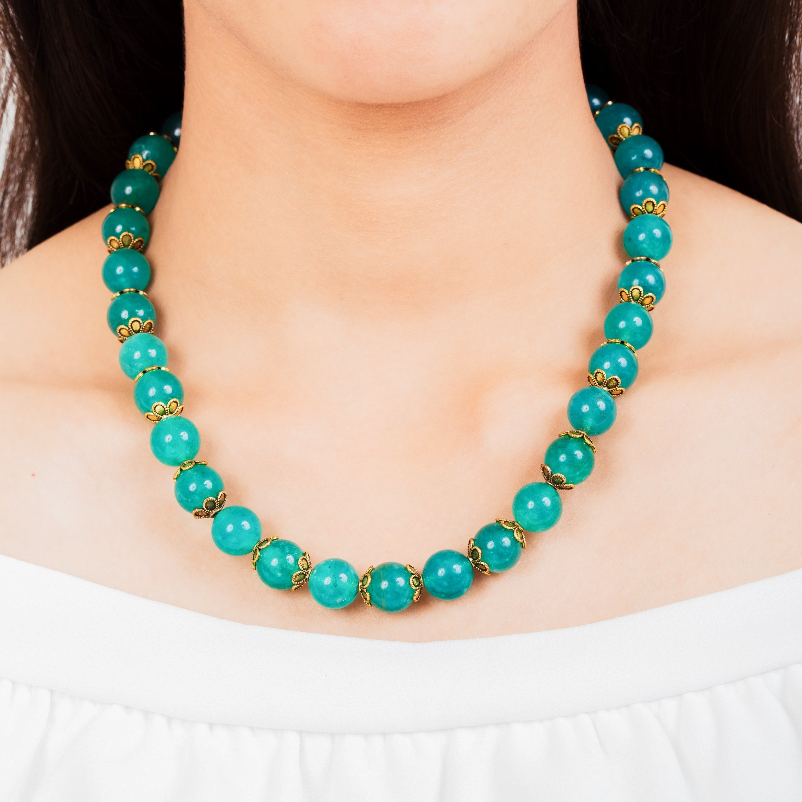 Niz & Aly aqua chalcedony beaded necklace with gold-tone filigree bead caps worn on a model