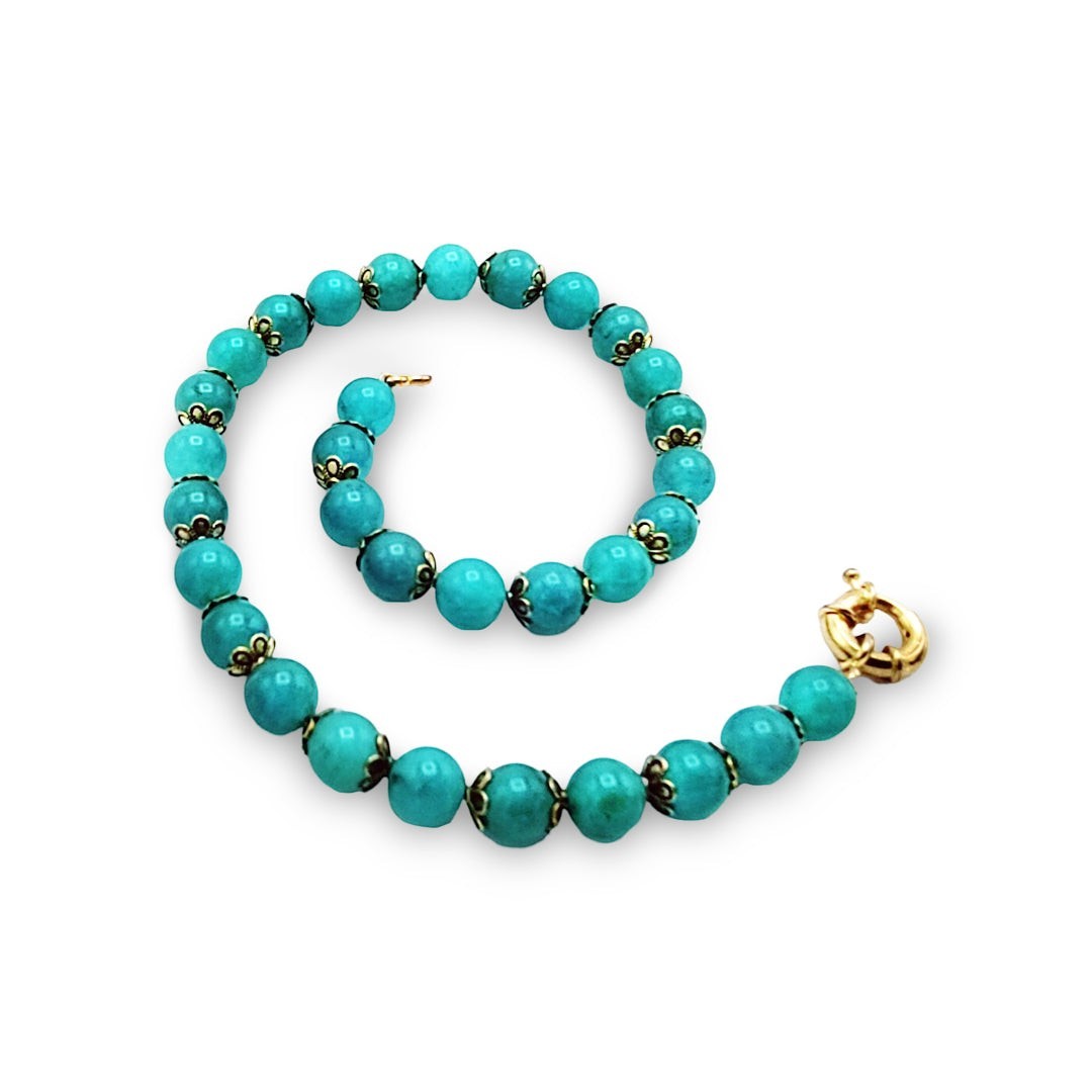 Niz & Aly aqua chalcedony beaded necklace with gold-tone filigree bead caps and a gold clasp on a white background.