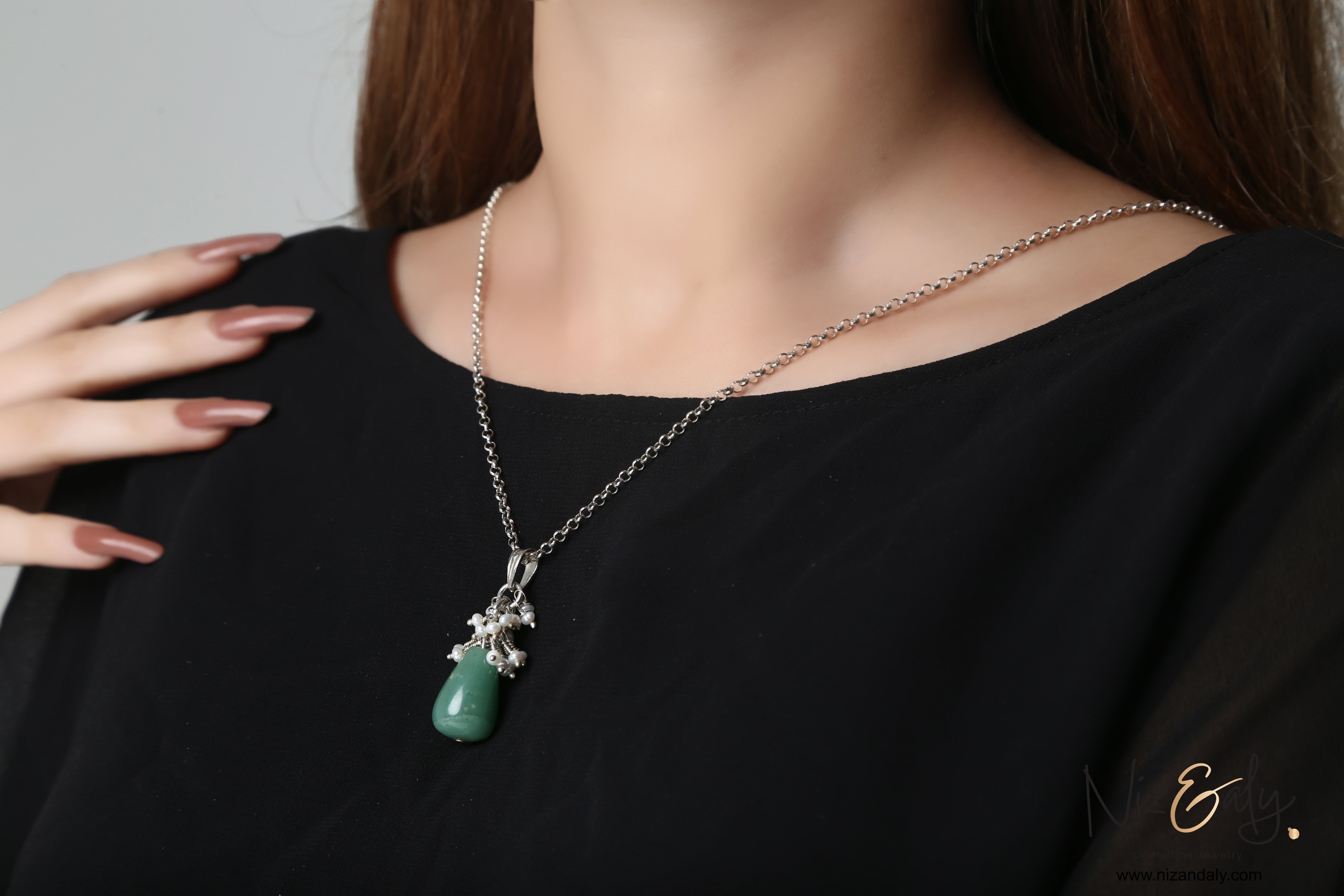 Niz & Aly dainty aventurine and freshwater pearl drop pendant on a silver chain worn against a black top