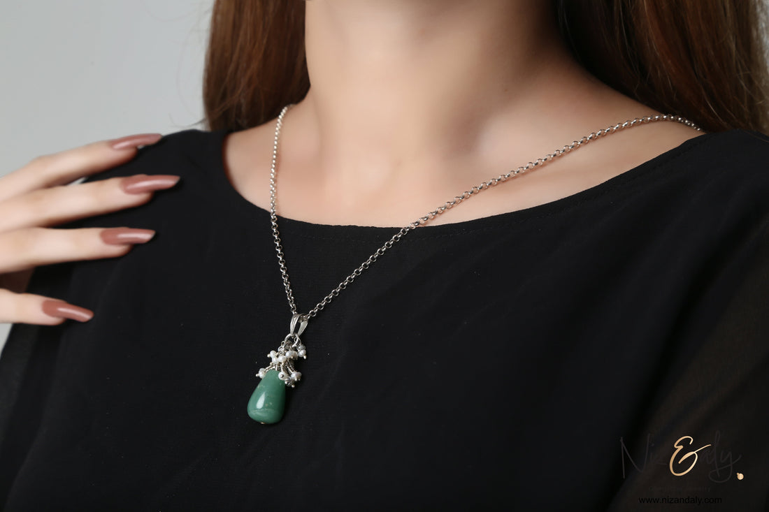 Niz & Aly dainty aventurine and freshwater pearl drop pendant on a silver chain worn against a black top
