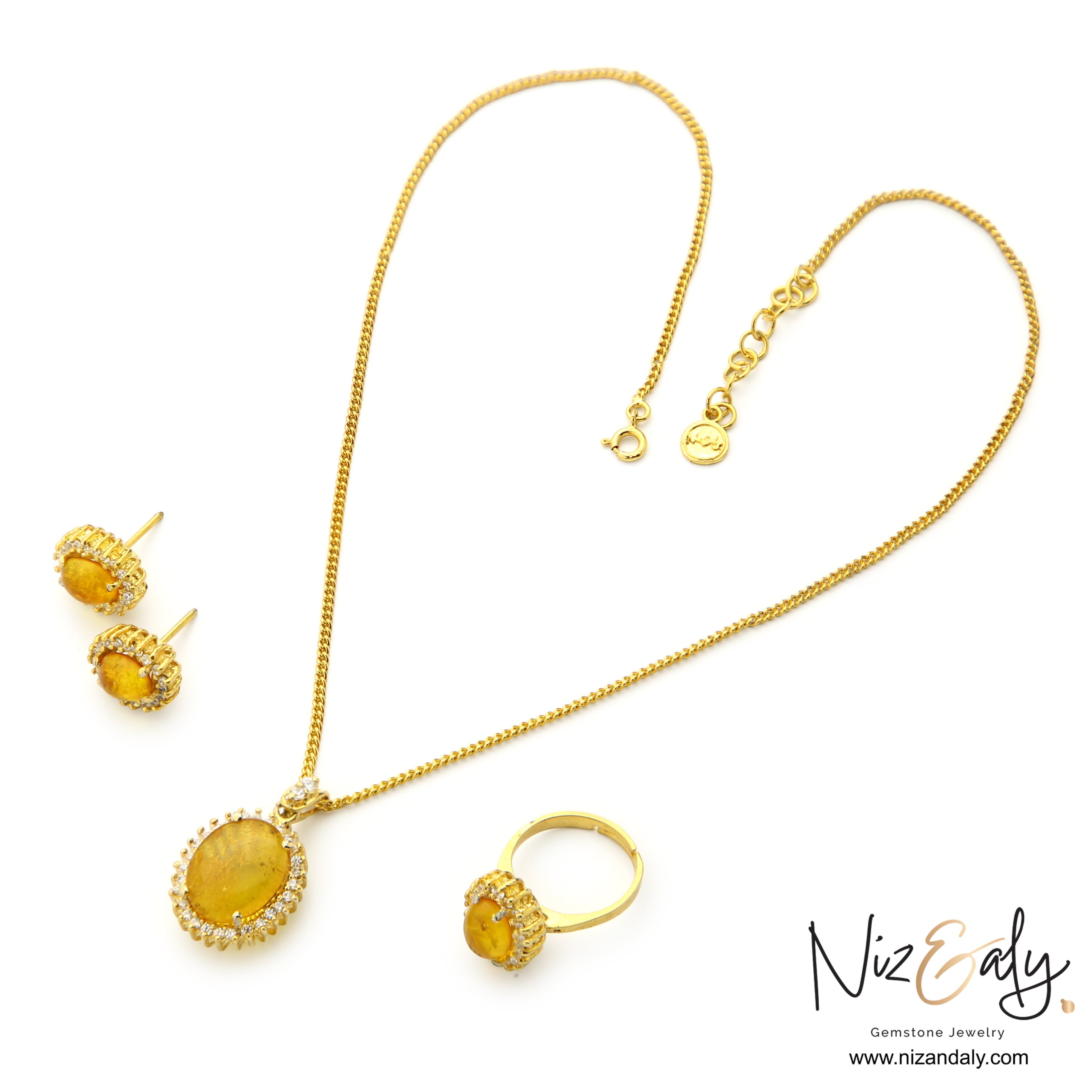 Niz & Aly genuine Baltic amber jewelry set featuring a gold-plated pendant necklace, stud earrings, and a ring.