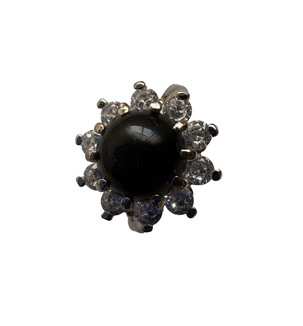 Niz & Aly adjustable ring featuring a round black onyx gemstone surrounded by a halo of sparkling white crystals.