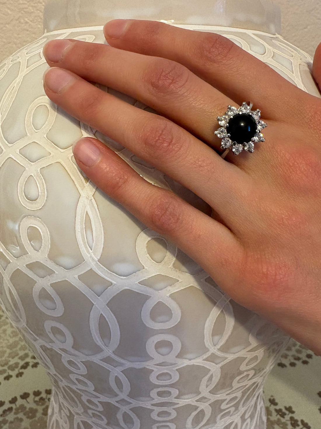 Niz & Aly natural black onyx ring featuring a halo of sparkling crystals on an adjustable silver band