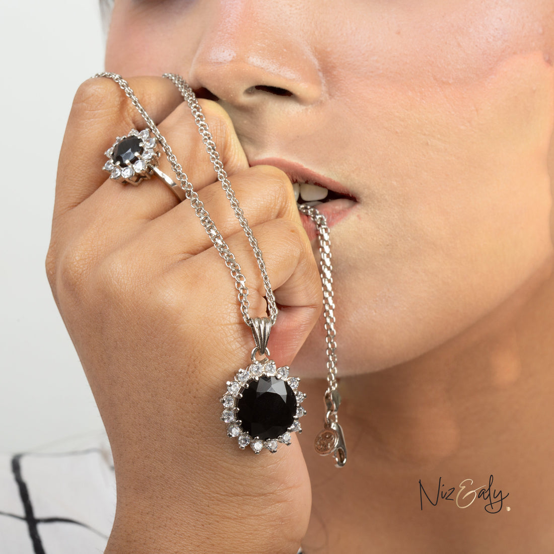 Niz & Aly Timeless Black Onyx Set featuring a polished black onyx pendant necklace and matching ring with crystal halo