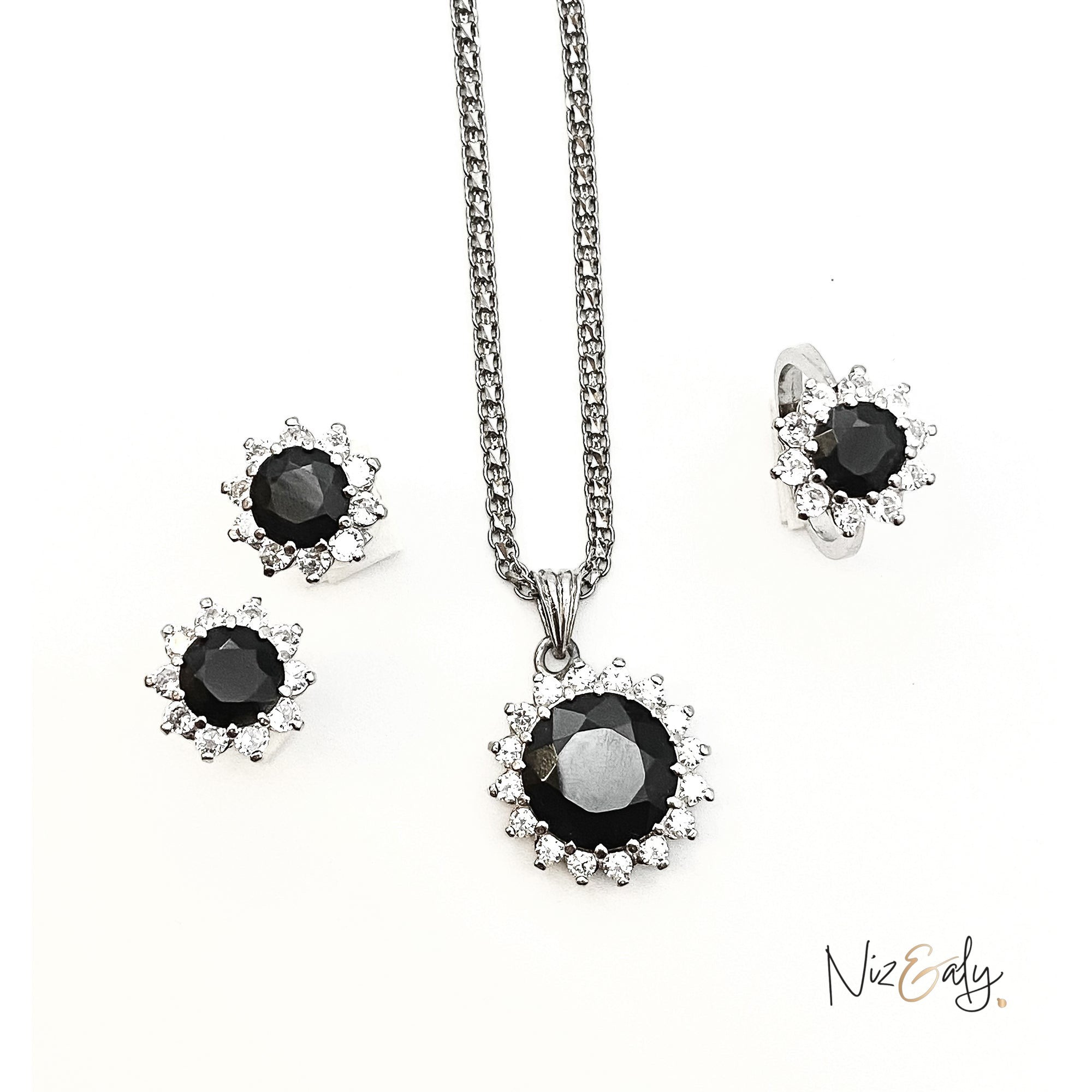 Niz & Aly Timeless Black Onyx Set featuring a pendant necklace and matching earrings with polished black gemstones.