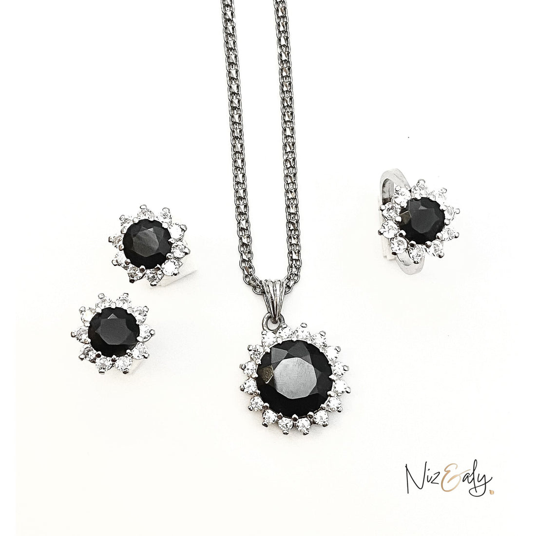 Niz & Aly Timeless Black Onyx Set featuring a pendant necklace and matching earrings with polished black gemstones.