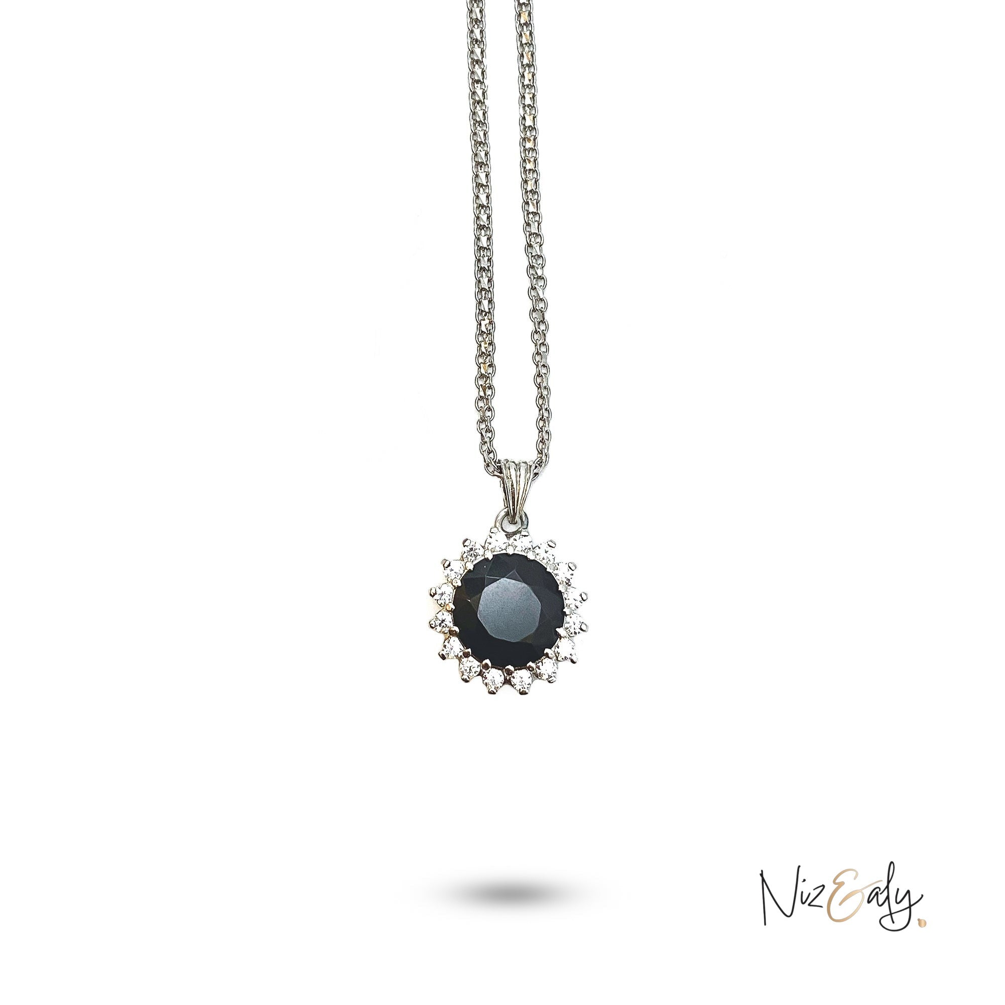 Niz & Aly pendant necklace featuring a round polished black onyx gemstone surrounded by a halo of sparkling crystals.