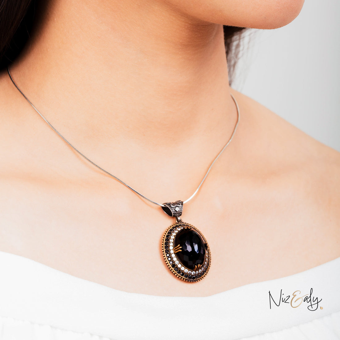 Niz & Aly faceted black onyx pendant necklace with VVS cubic zirconia and tiny onyx accents on a silver chain