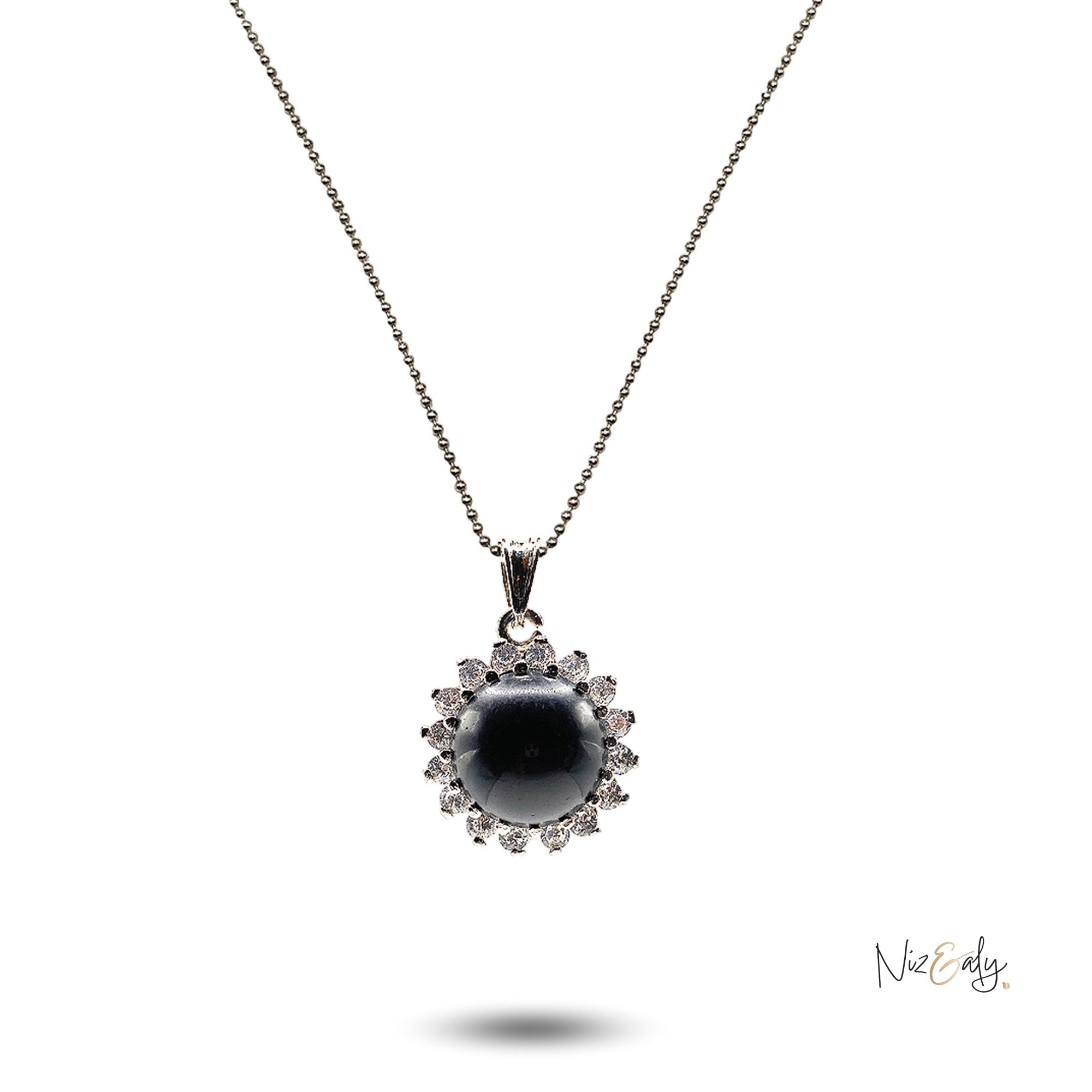 Niz & Aly black onyx cabochon pendant necklace surrounded by sparkling cubic zirconia stones on a delicate silver chain