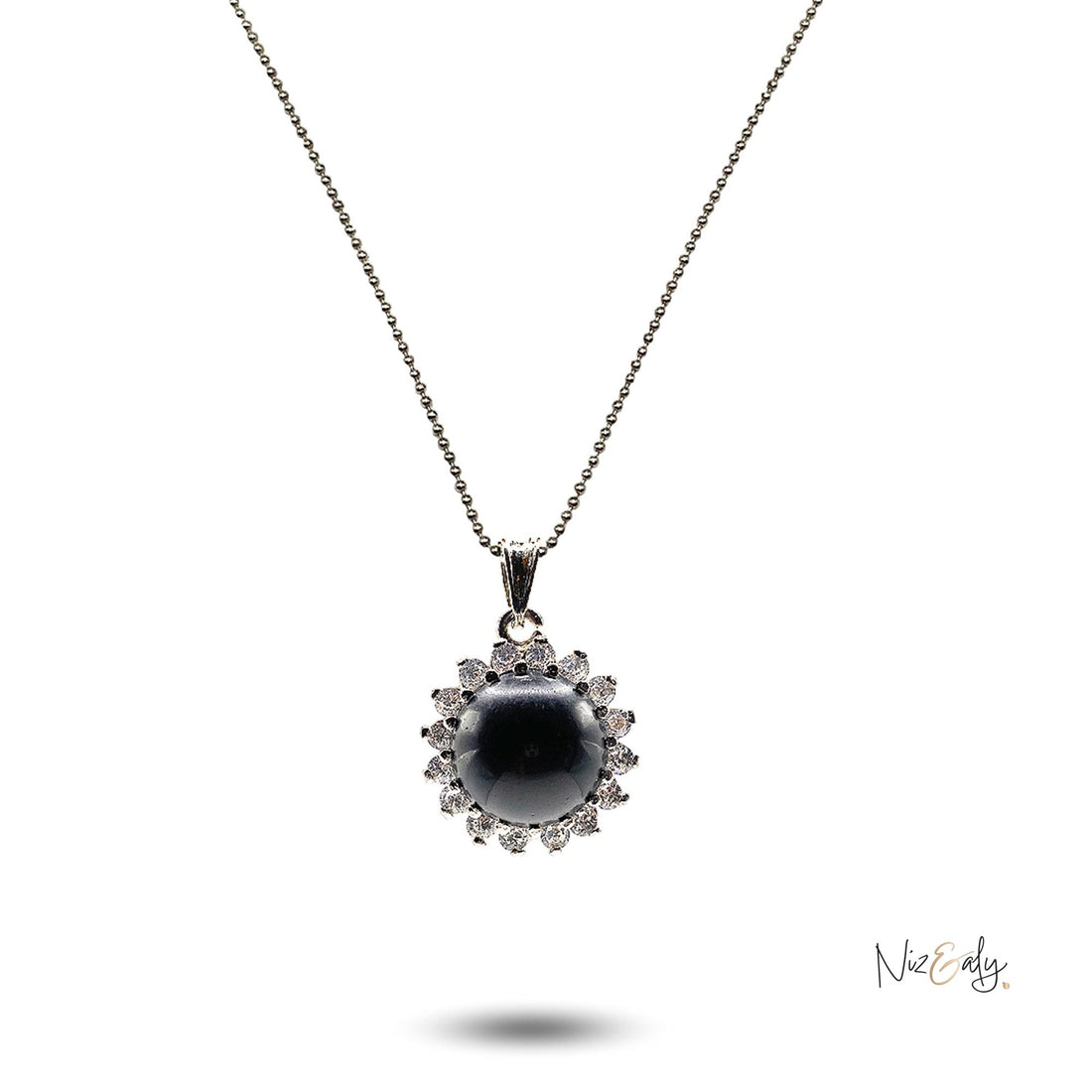 Niz & Aly black onyx cabochon pendant necklace surrounded by sparkling cubic zirconia stones on a delicate silver chain