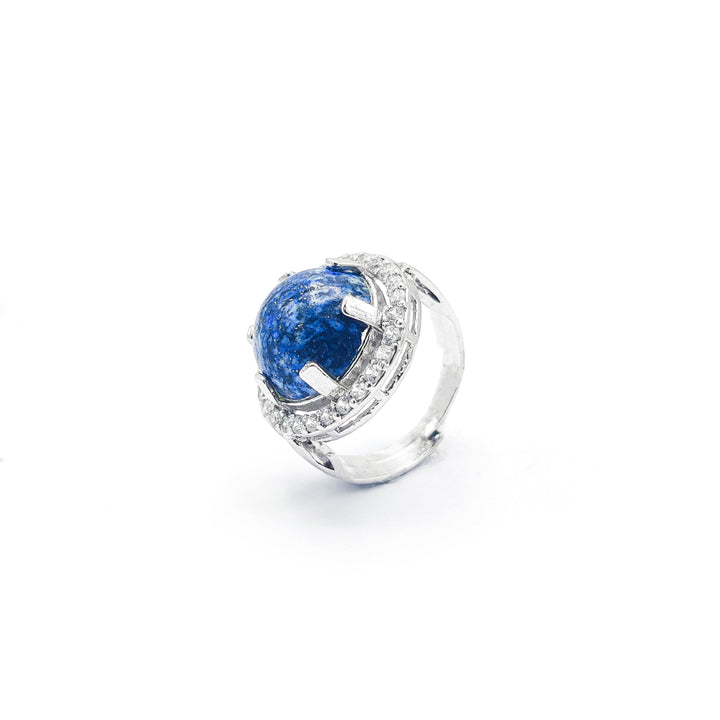 Niz & Aly Celestial Blue Lapis ring featuring a round deep blue lapis lazuli stone with gold flecks in a silver setting